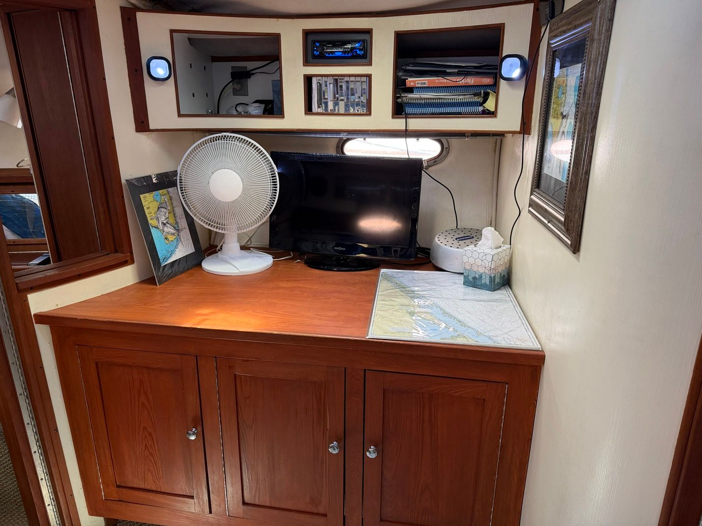 1988 Regal Commodore 360 yacht interior with cabinet and electronics.