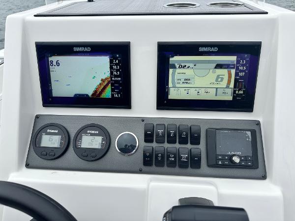 Control panel of 2025 Starcraft SVX 211 OB CC boat with Simrad displays.