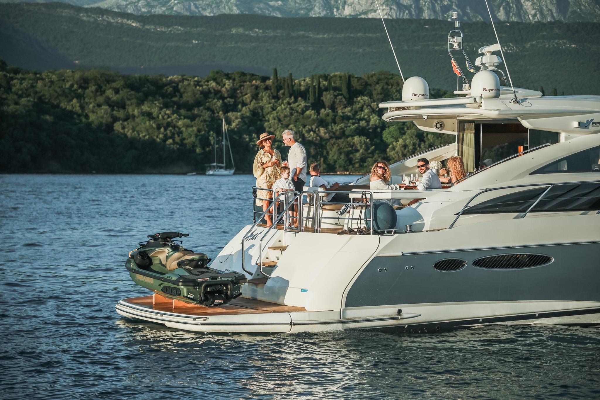 Luxury yacht Princess V65 cruising with passengers, scenic backdrop, 2008 model.