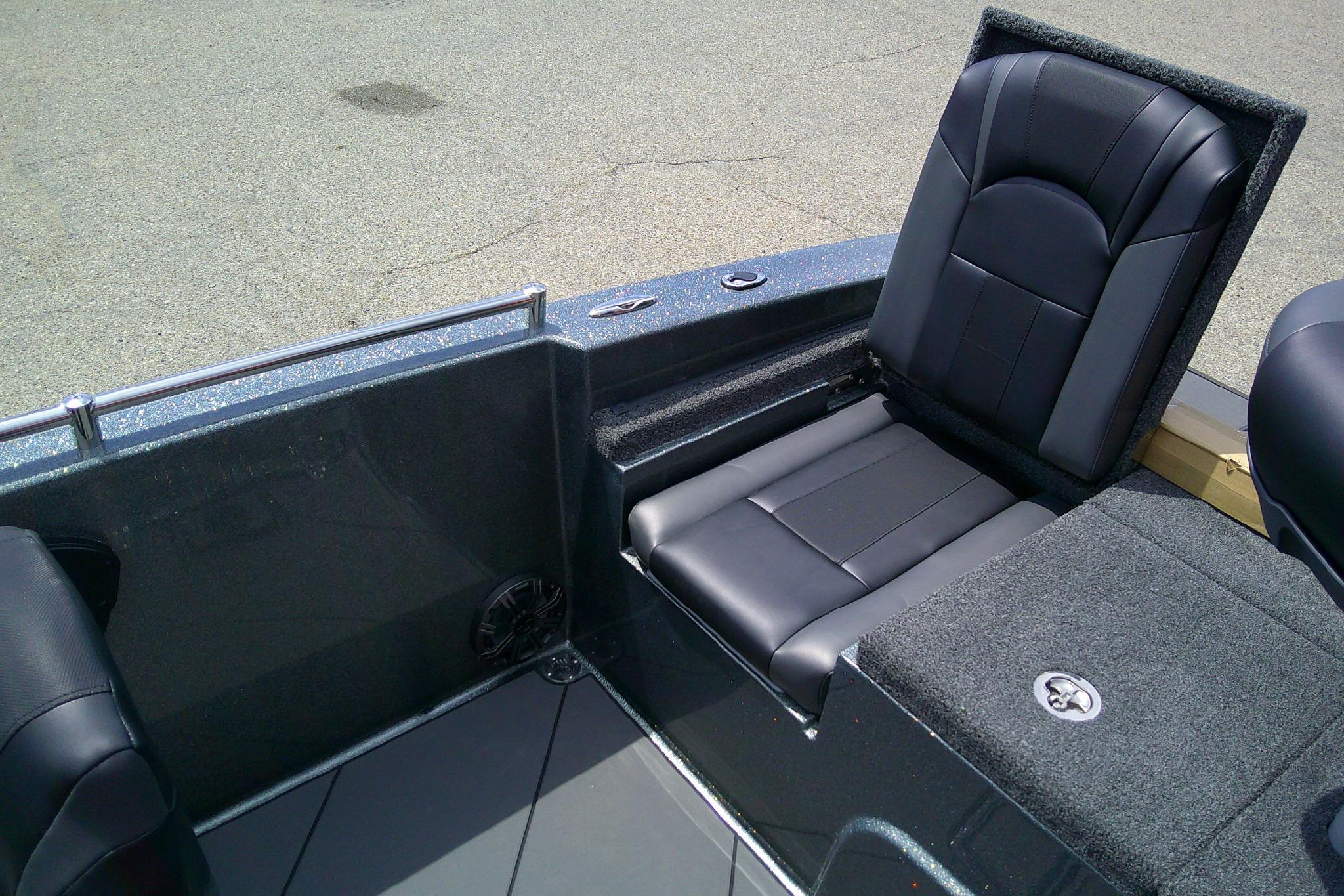 2026 Nitro ZV19 Sport boat interior with black leather seating and carpeted flooring.
