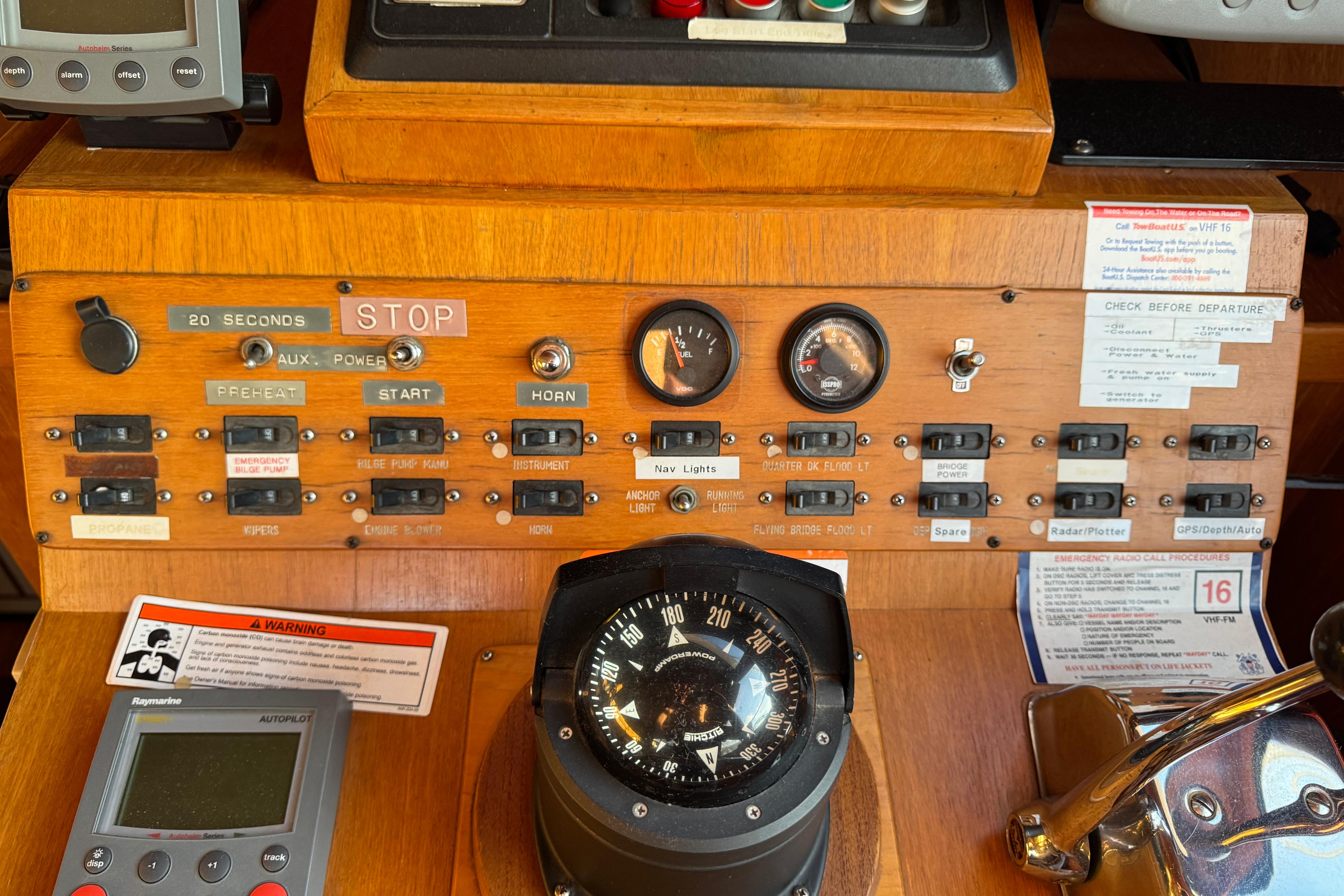 Control panel of a 1987 President 37 boat with gauges and switches.