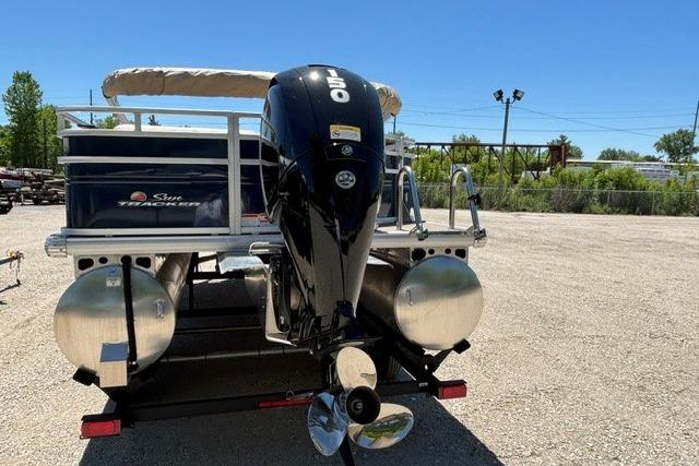 2025 Sun Tracker Fishin' Barge 22 DLX pontoon boat with outboard motor.