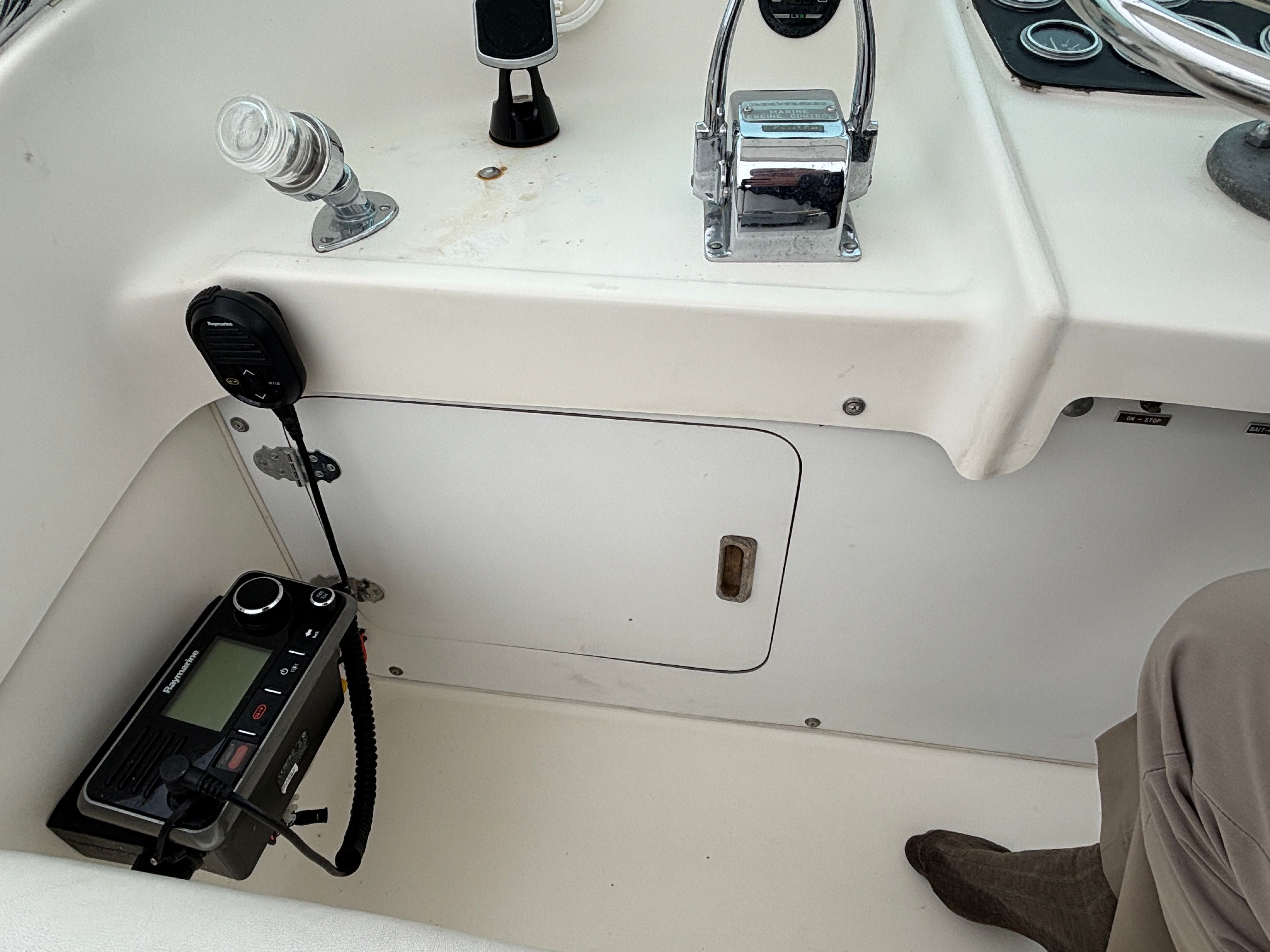 Interior of a 1978 Bertram MOPPIE boat with controls and radio.