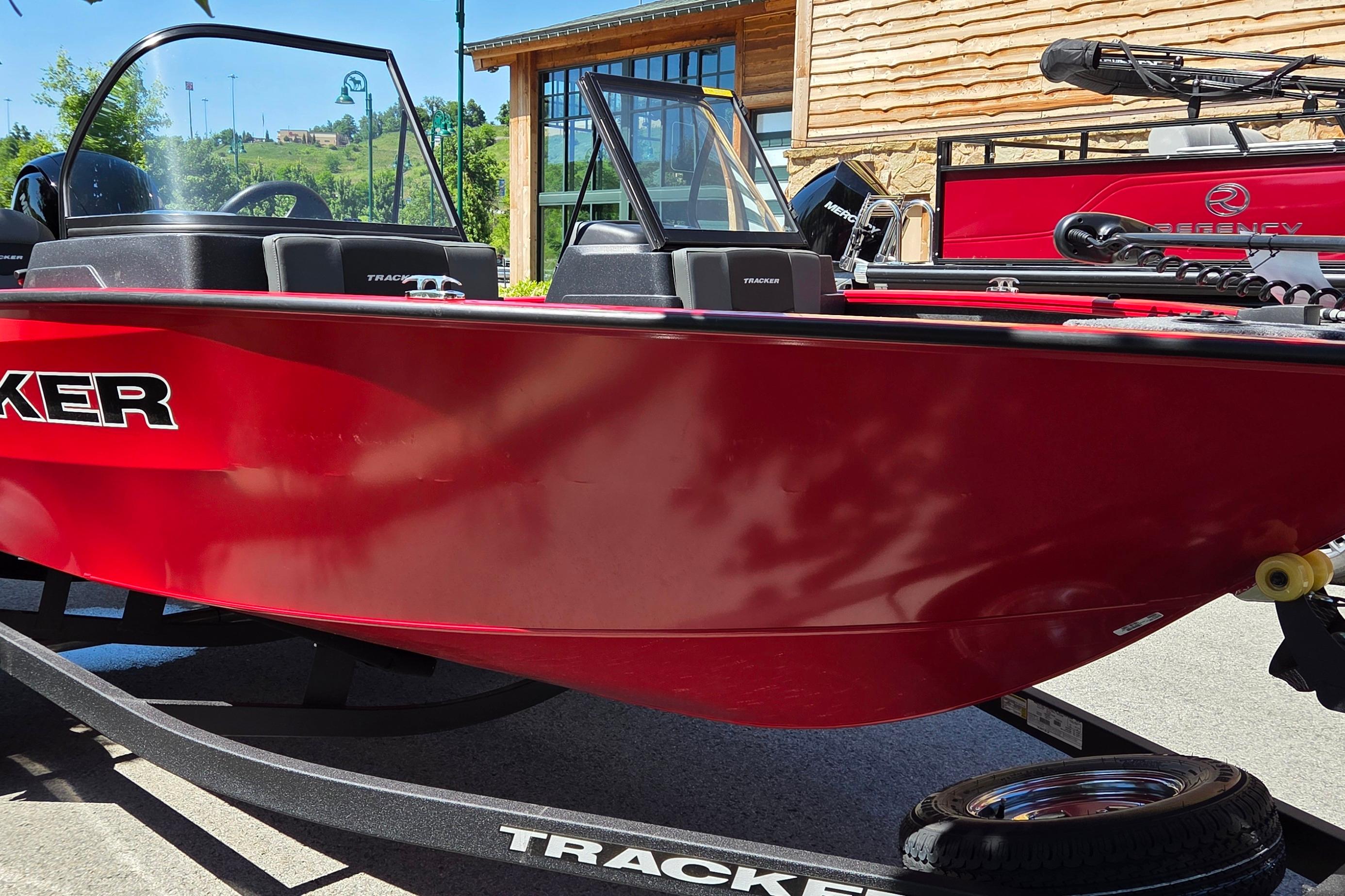 2026 Tracker Pro Guide V-175 Combo boat in vibrant red on trailer.
