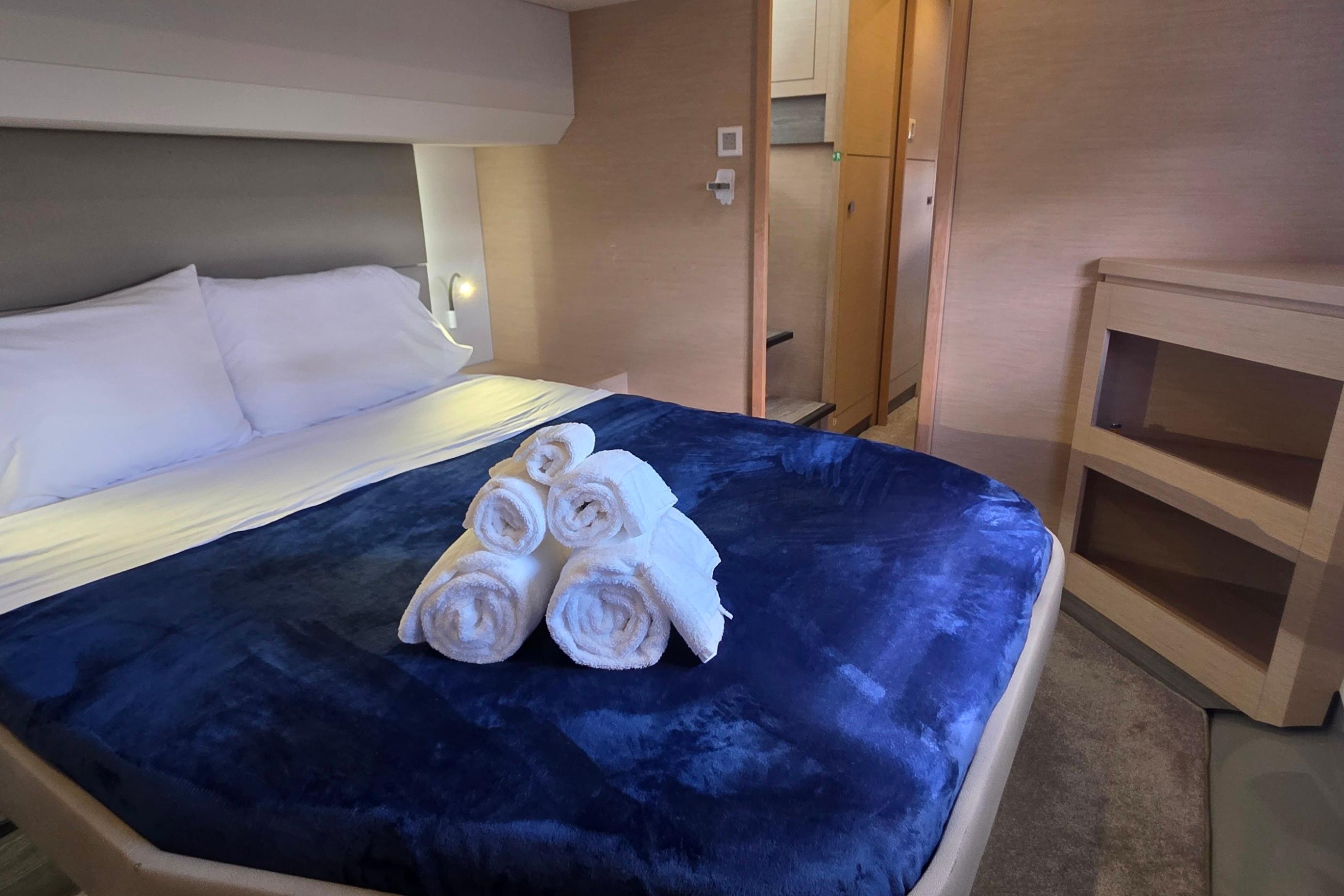 Luxurious bedroom interior of 2018 Fountaine Pajot Motor Yacht 44 with plush bedding.
