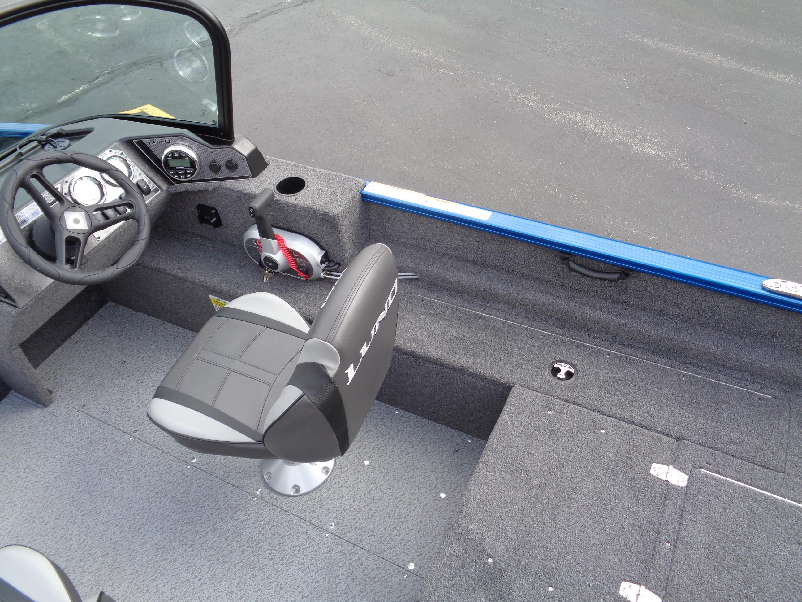 2024 Lund 1650 Rebel XL Sport boat interior with steering wheel and seating.