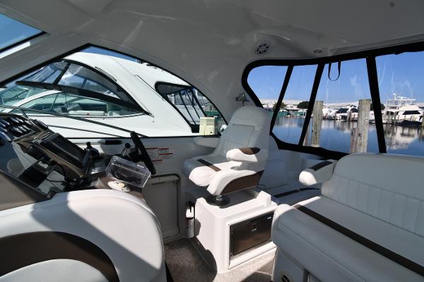 Interior of 2010 Cruisers Yachts 390 Sports Coupe, featuring helm and seating area.