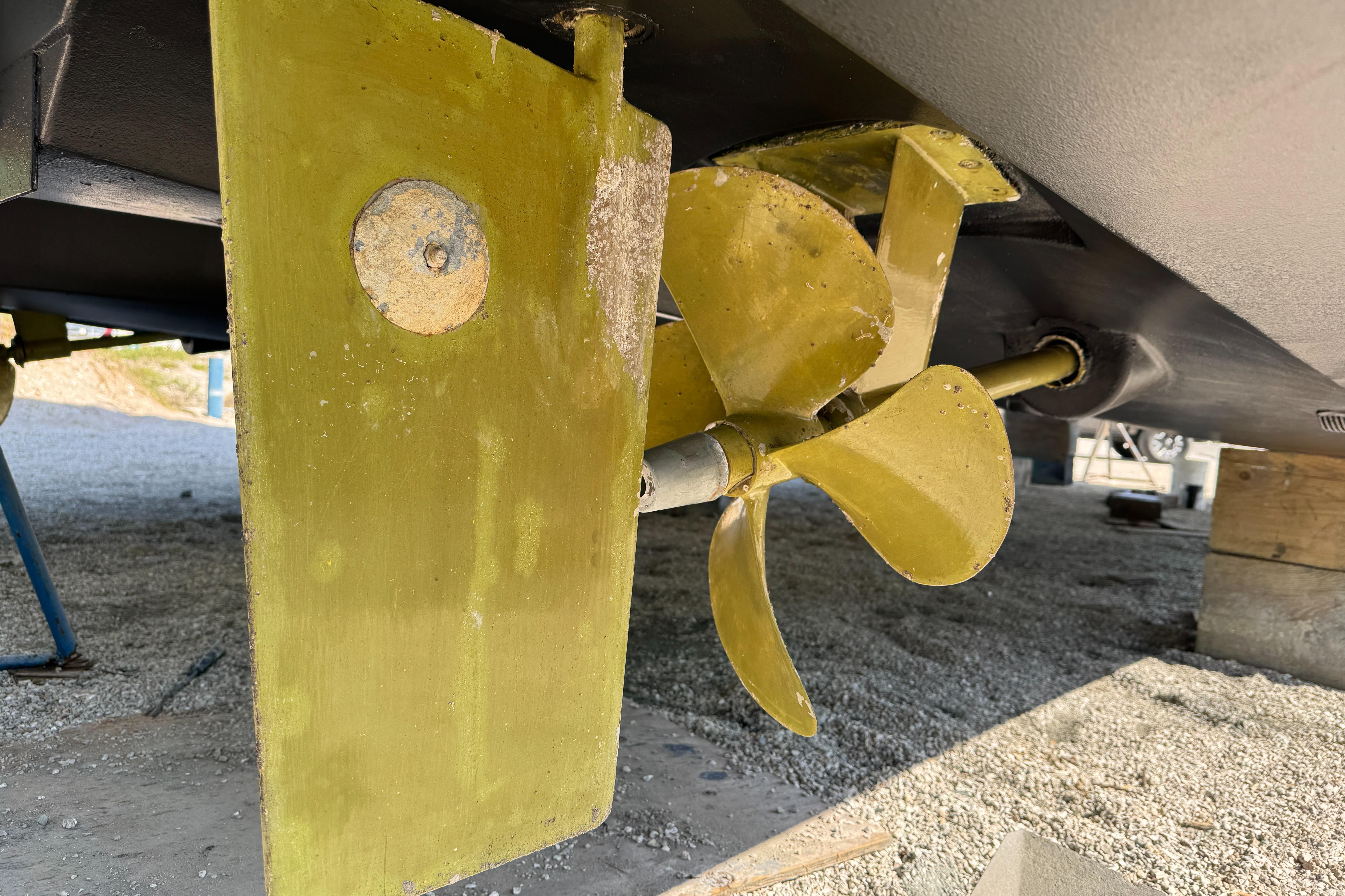 Propeller and rudder of 2021 Fountaine Pajot MY4.S catamaran on dry dock.