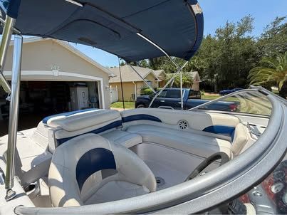 Interior view of a 2011 Tahoe 216 WT boat with blue and white seating.