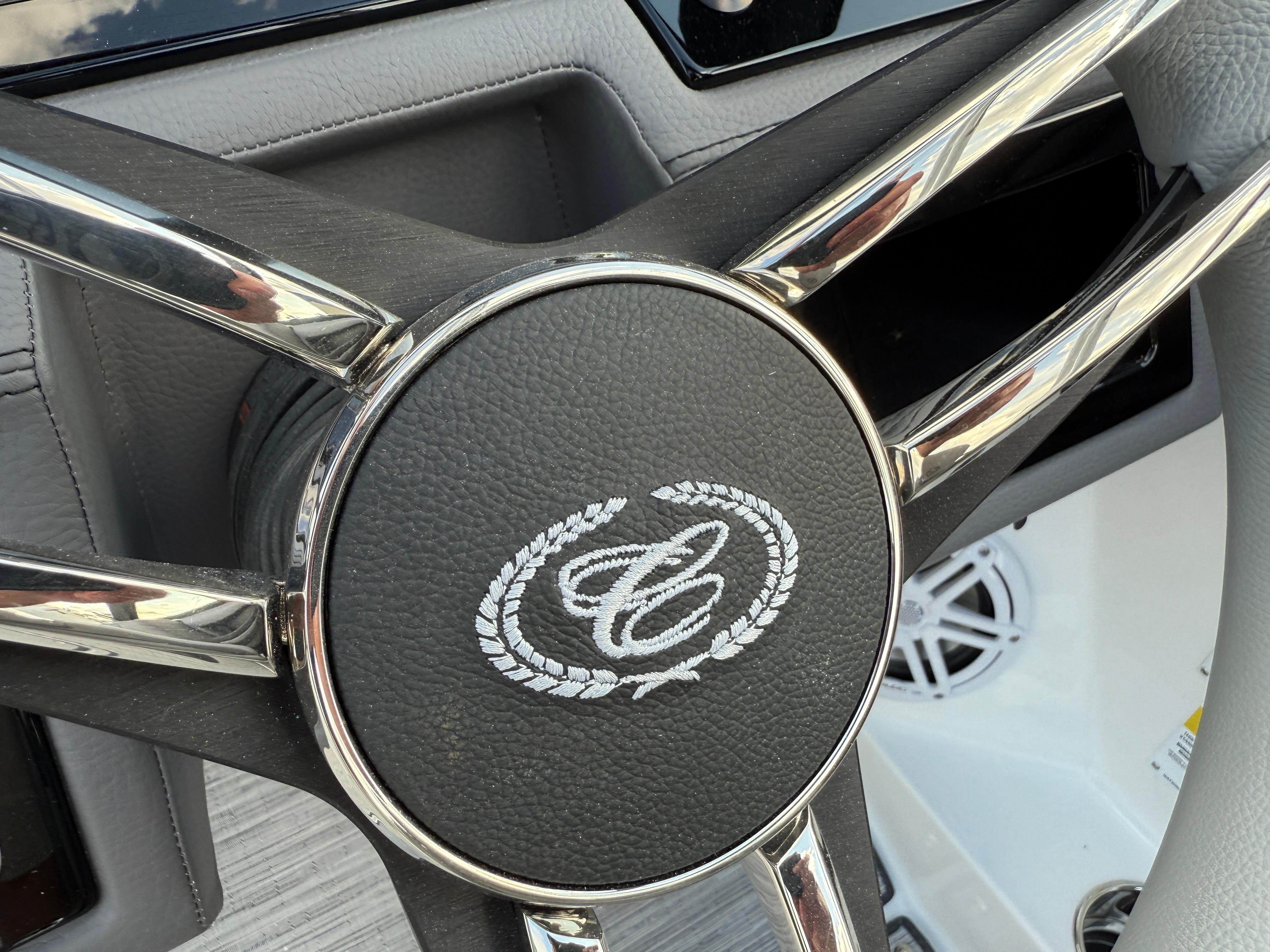 Steering wheel of 2025 Cobalt R6 boat with logo emblem.