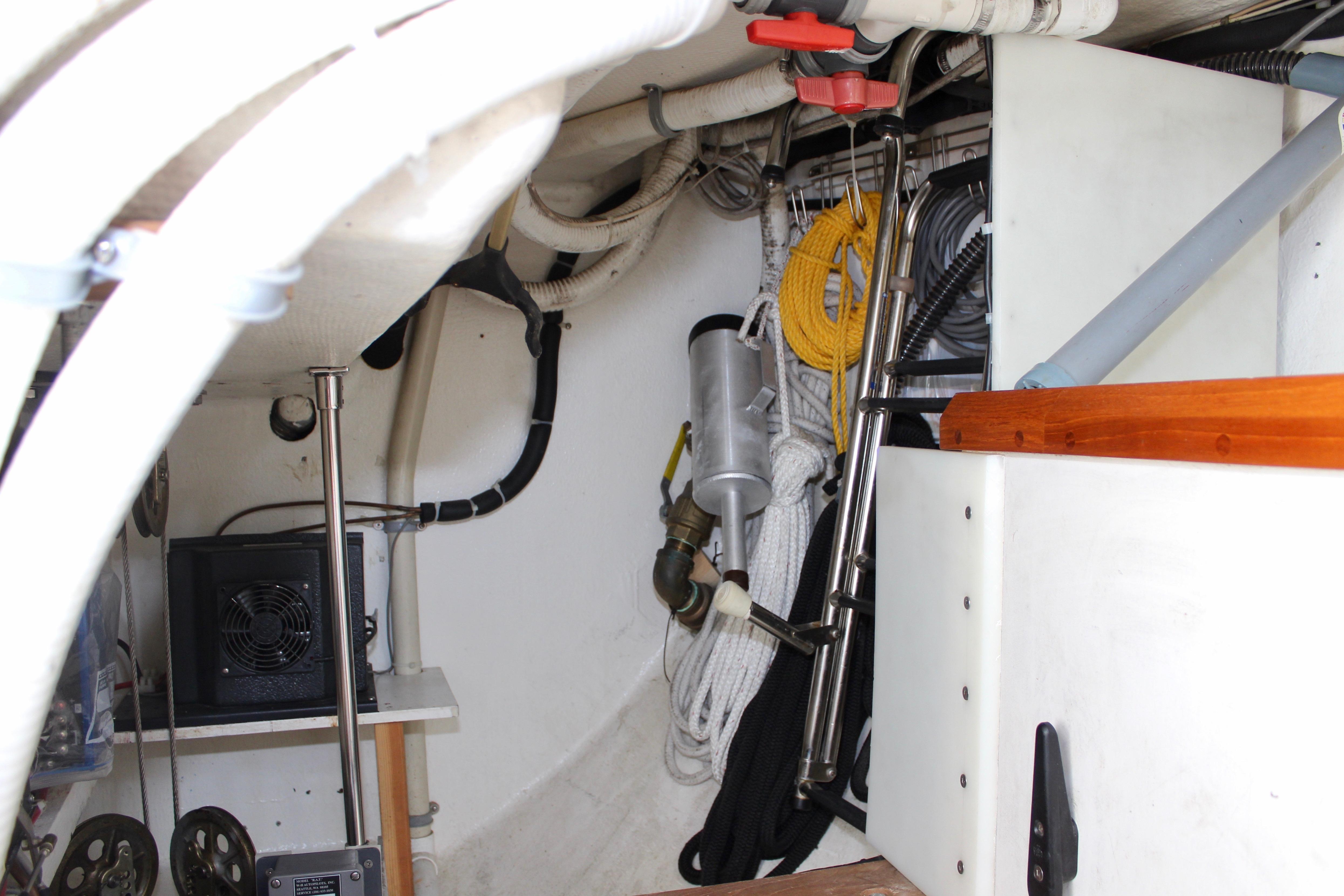 Engine room of a 1993 Freya 39 sailboat with ropes and equipment.