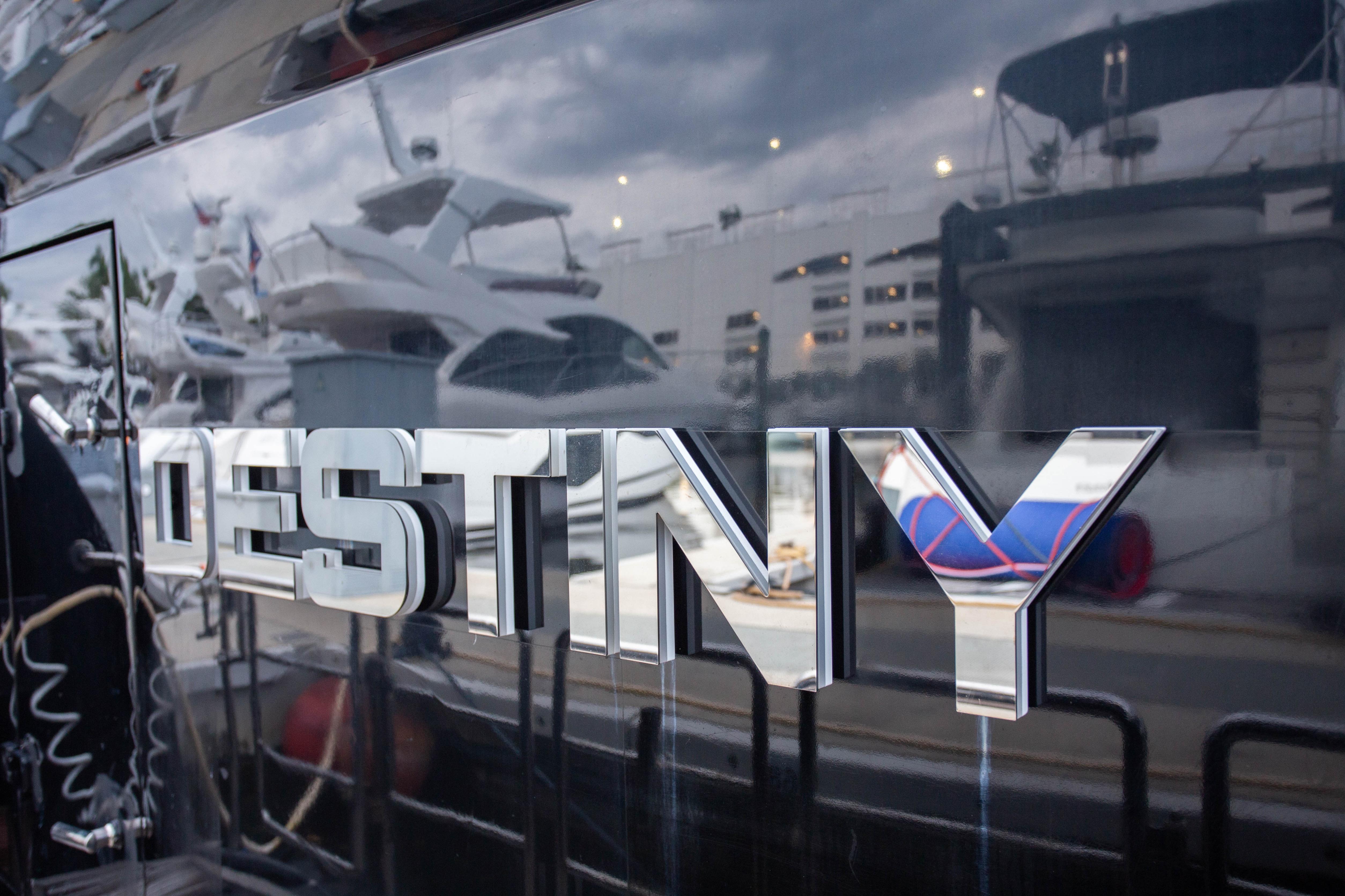 Chrome lettering "DESTINY" on Fifth Ocean Yachts 24m Explorer Yacht, 2014 model.
