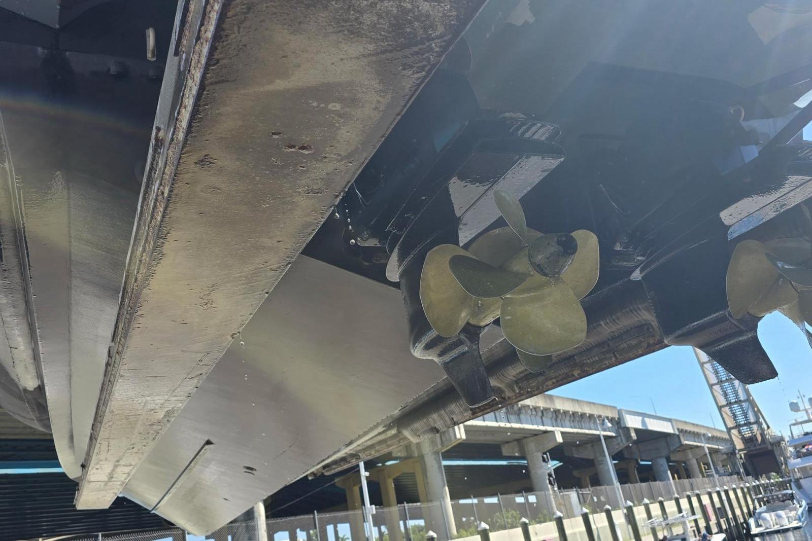 Underwater view of 2019 SACS Rebel 40 boat propellers at a dock.