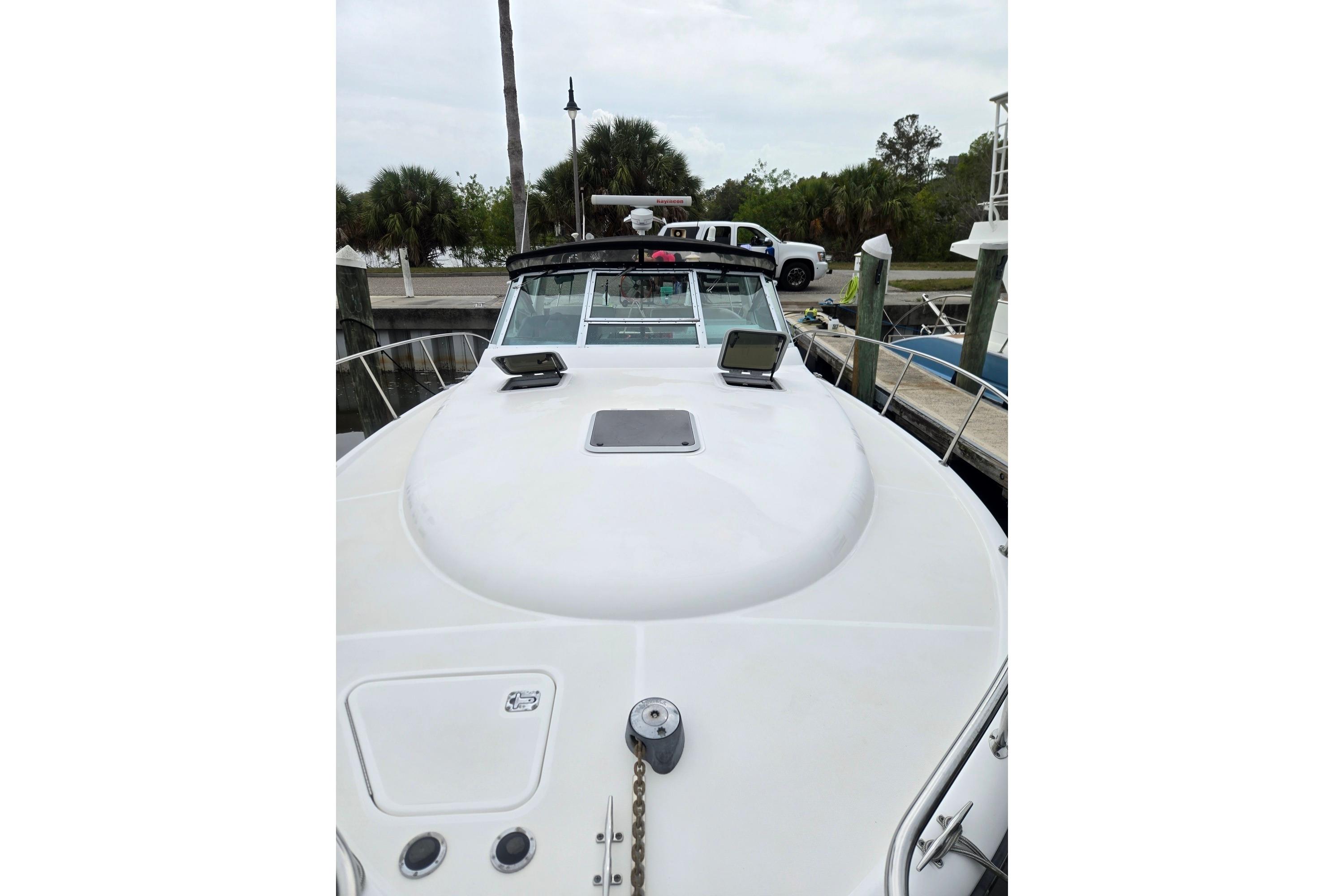 2002 Tiara Yachts 3500 Open docked, showcasing sleek bow design and deck features.