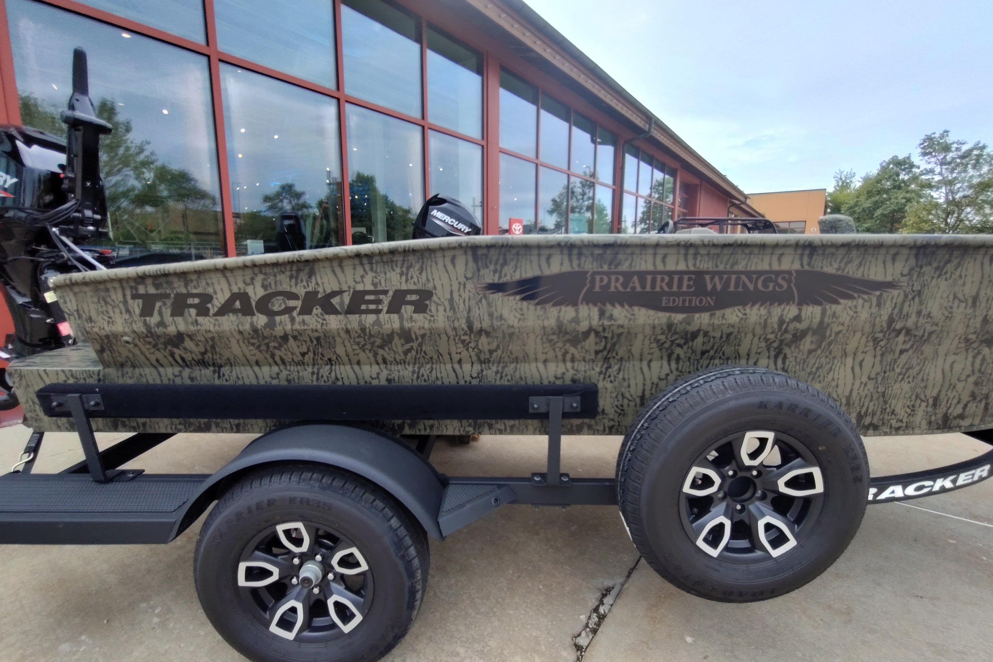 2026 Tracker Grizzly 1650 T Prairie Wings Edition boat on trailer, side view.