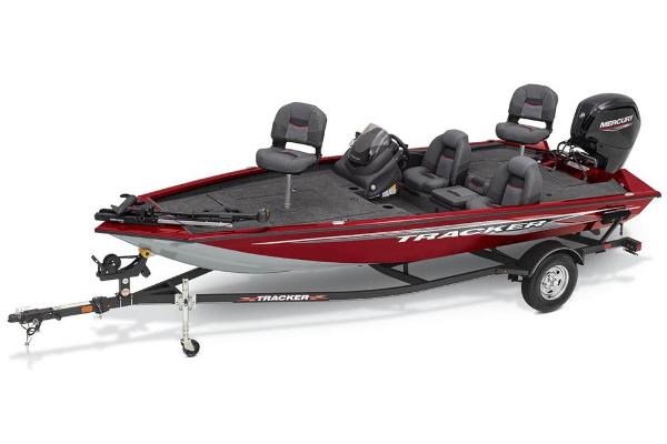 A red Tracker boat on a trailer, featuring four seats and a Mercury engine.