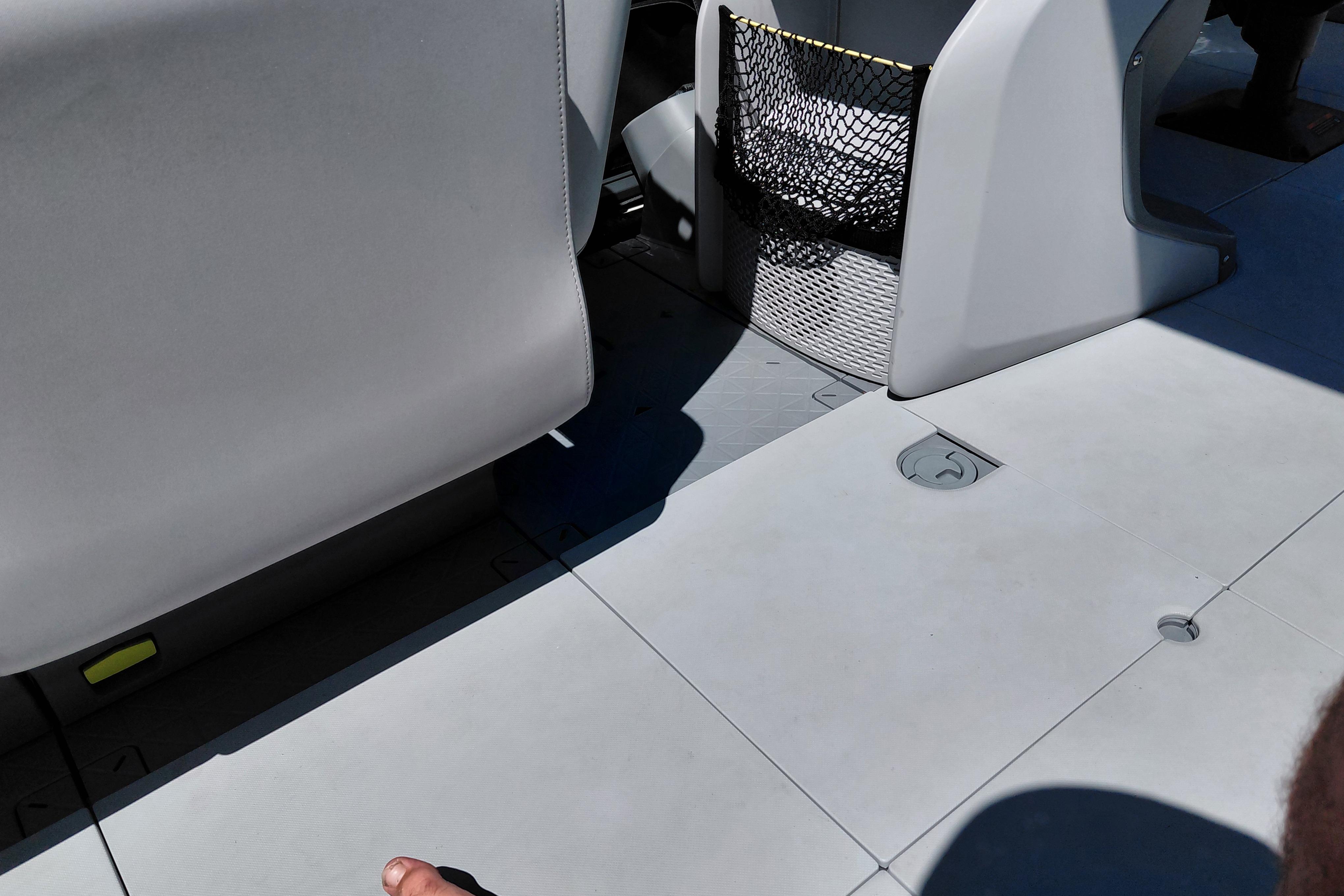Interior view of 2024 Sea-Doo Switch Cruise 18 with seating and storage net.