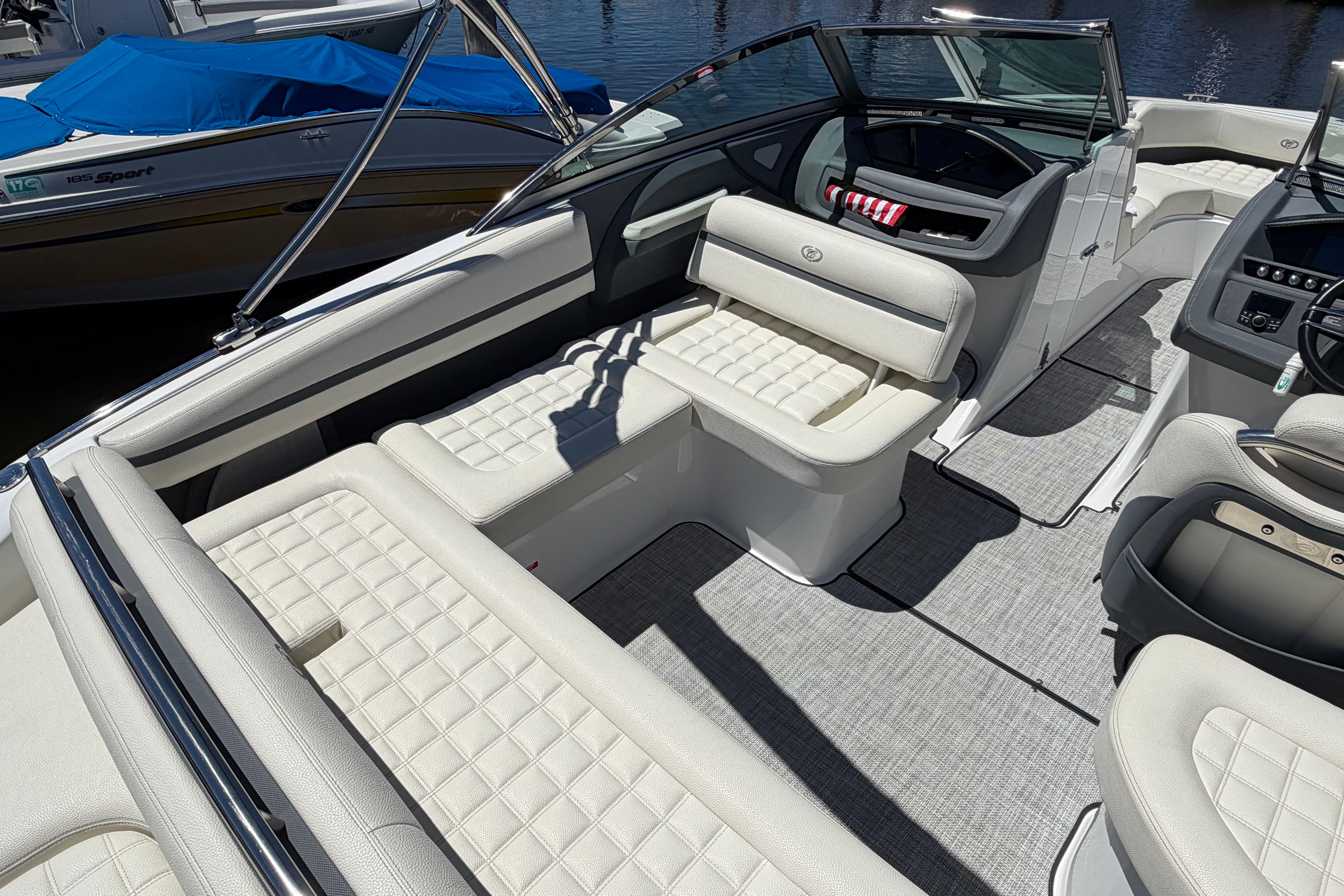 2020 Cobalt R3 boat interior with luxurious white seating and modern dashboard.