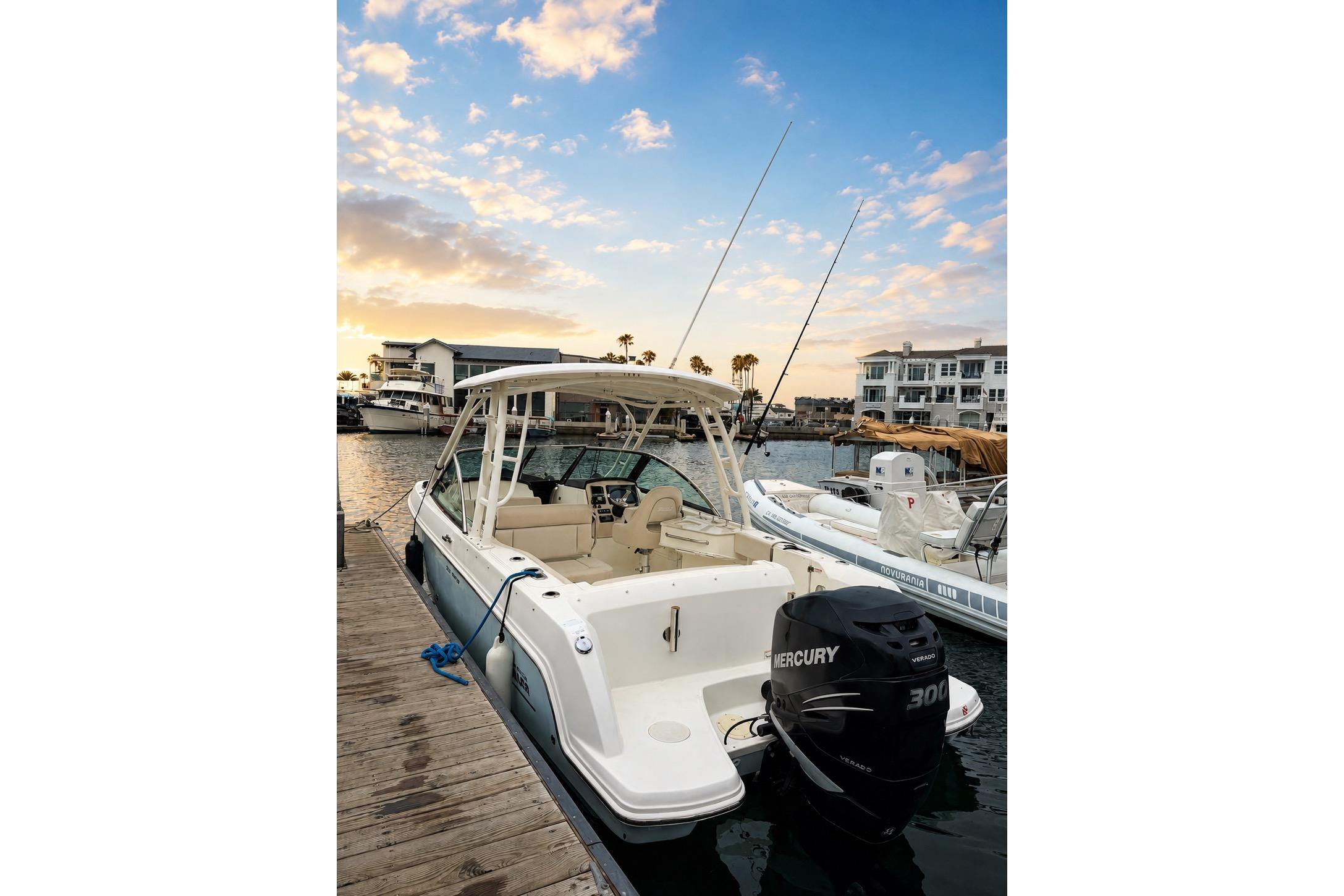 2017 Boston Whaler 230 Vantage docked at sunset, featuring a Mercury 300 engine.