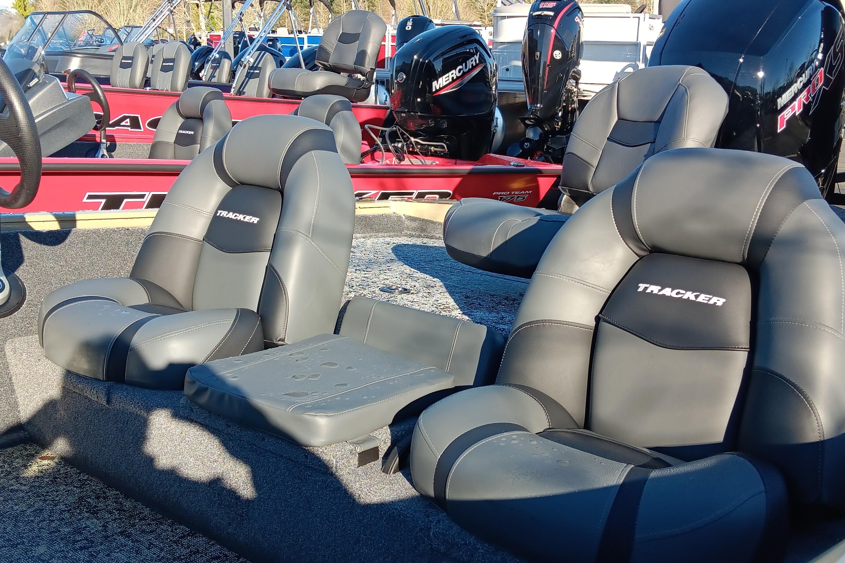 2026 Tracker Pro Team 195 boat seats with Mercury engines in background.