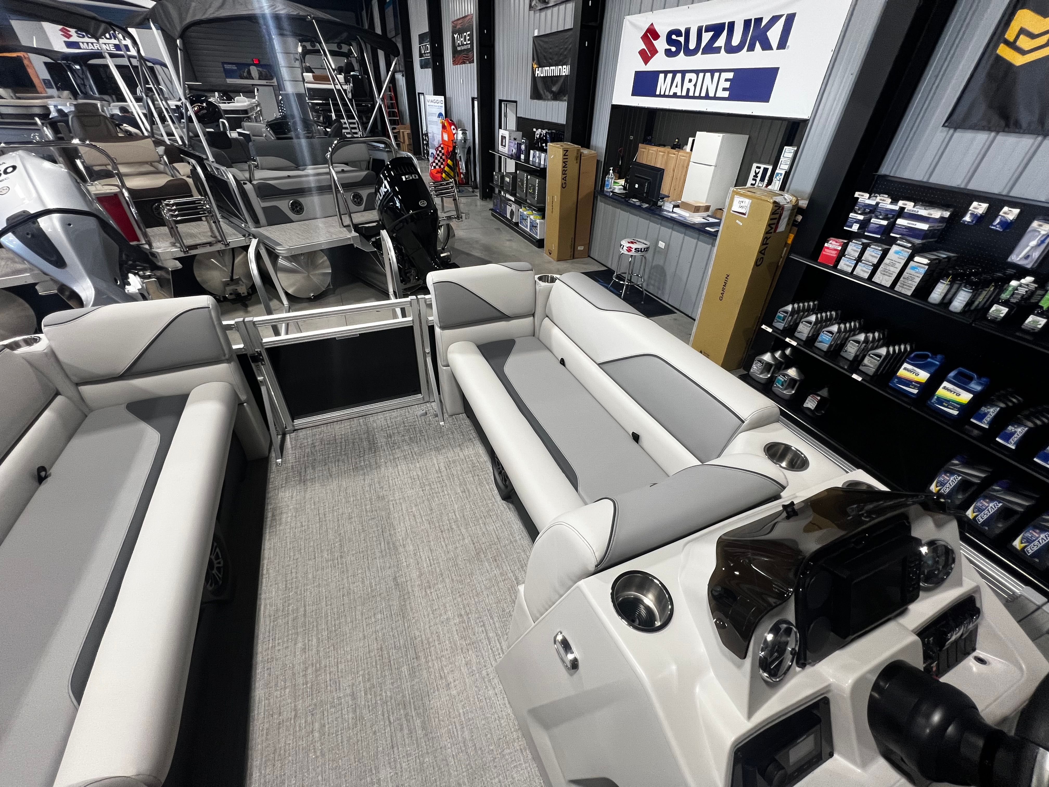 Interior view of 2026 Tahoe 2180 Sport Quad Lounger boat in showroom.