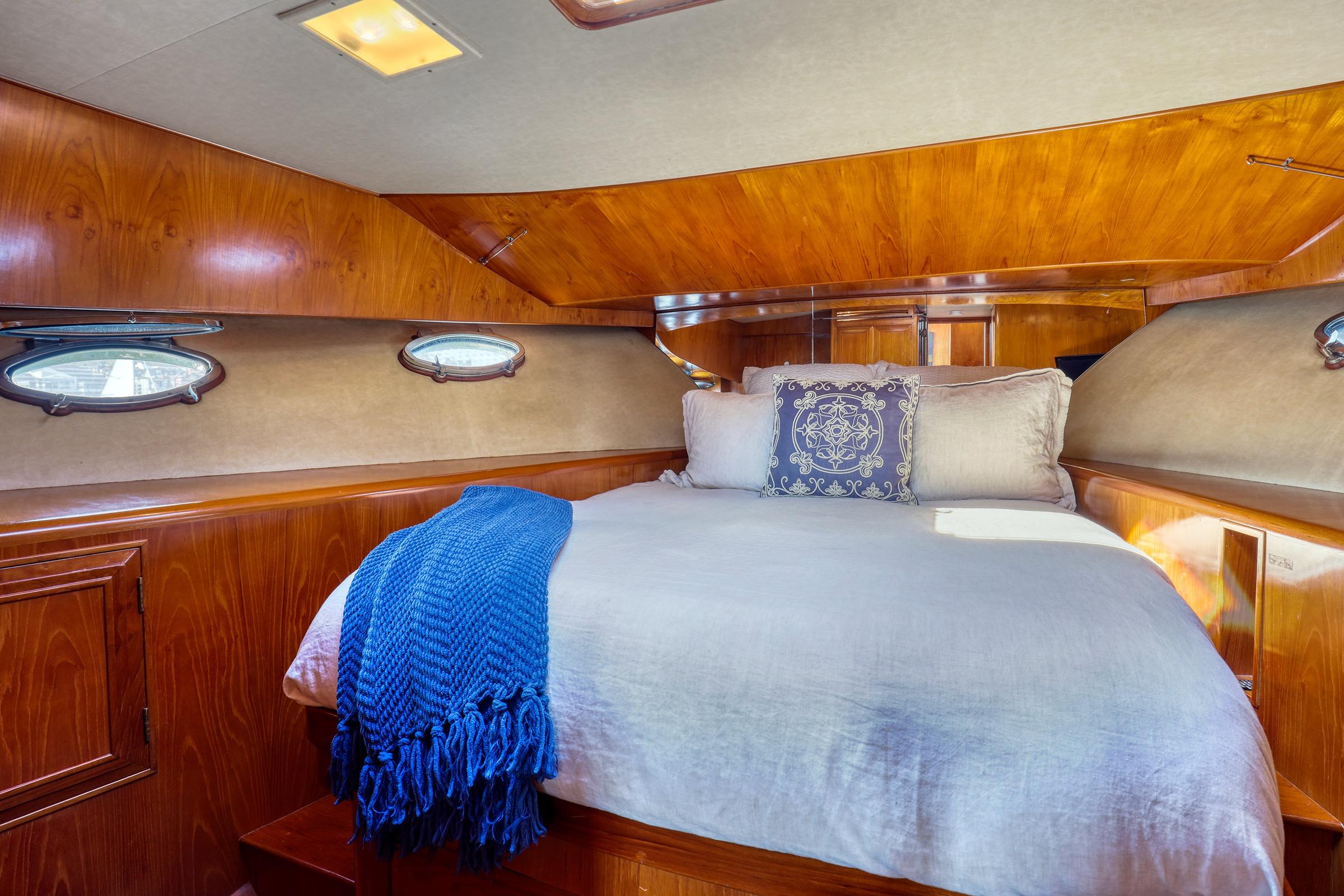 Cozy cabin interior of 1987 Ocean Alexander 480 Sport Sedan with elegant wood finish.