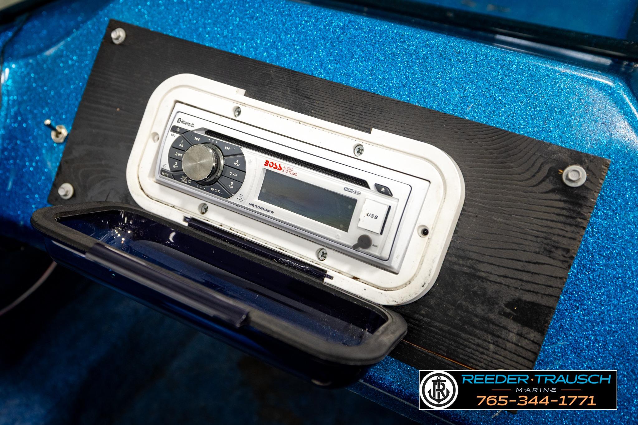Boat dashboard with Boss audio system in 1980 Ranger 175 VS.
