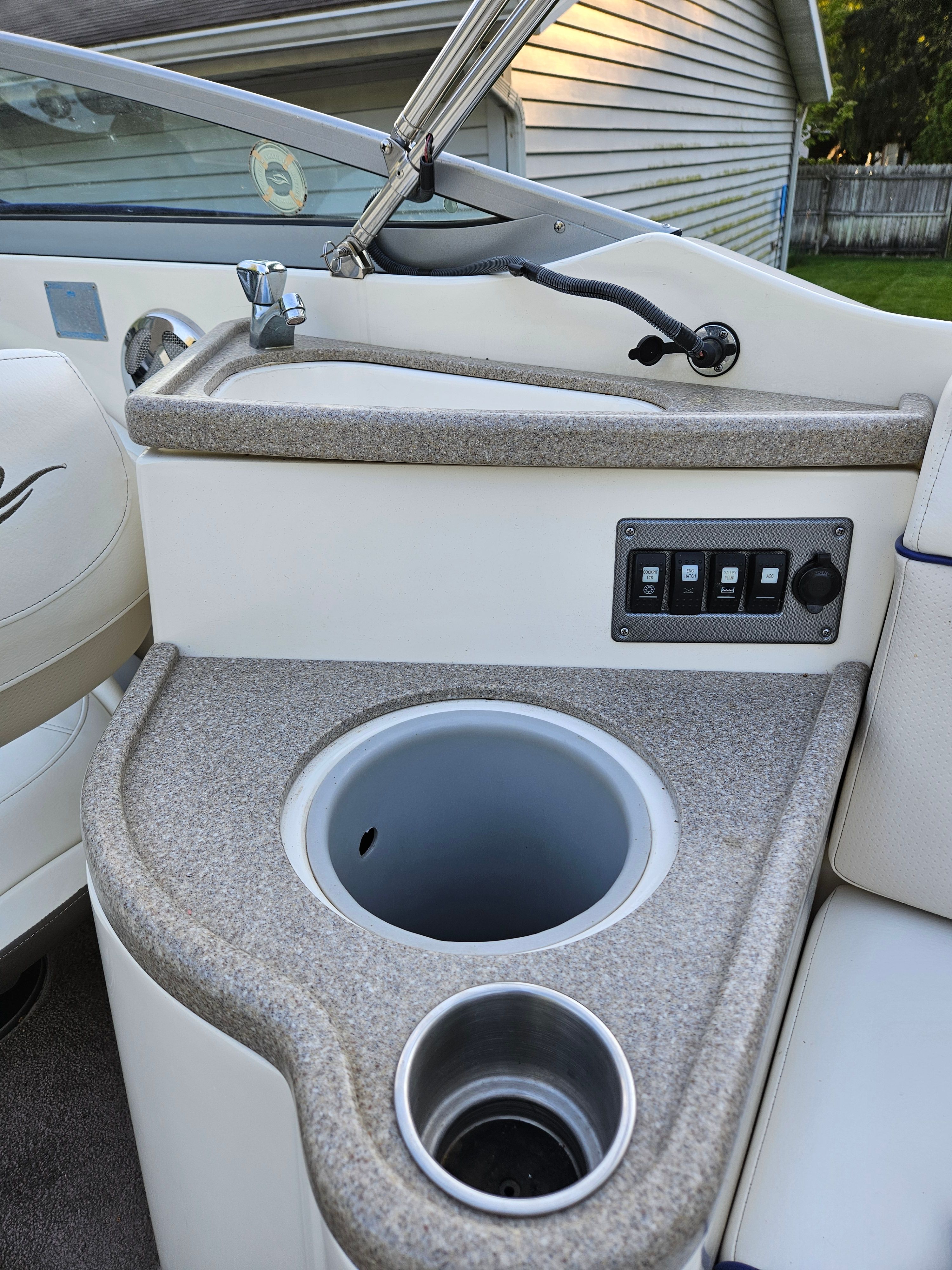 Interior of a 2009 Rinker Captiva DB boat with cup holder.
