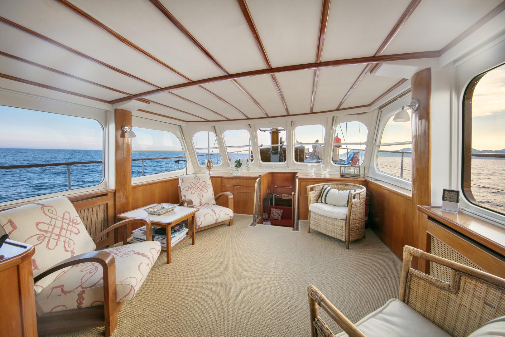 Luxurious interior of 1958 Feadship ATALANTA J yacht with ocean view.
