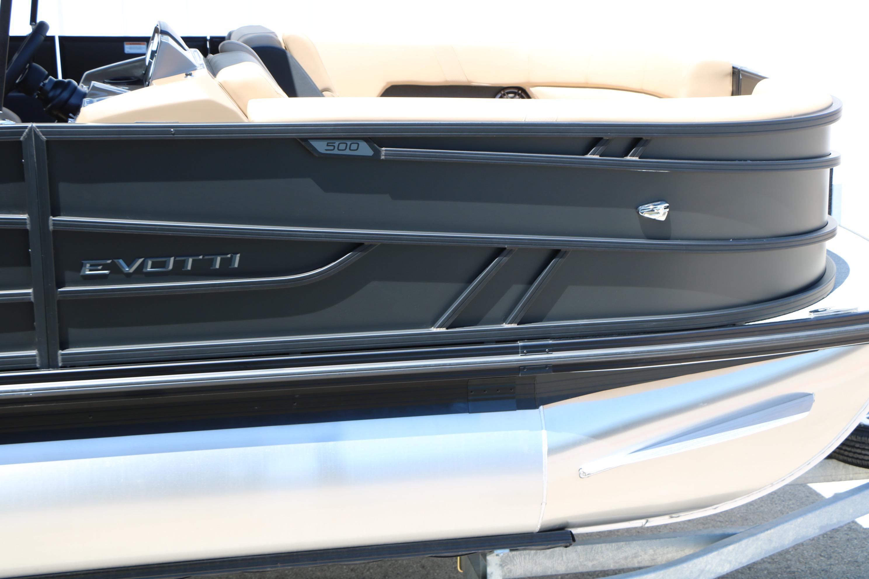 2026 Evotti 521CS boat side view with sleek black design and beige interior.