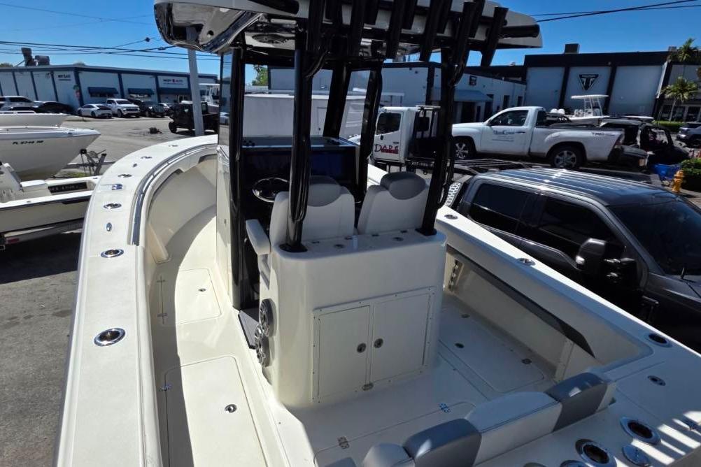 2024 Blackwood 290 boat interior with seating and console, parked in a marina.