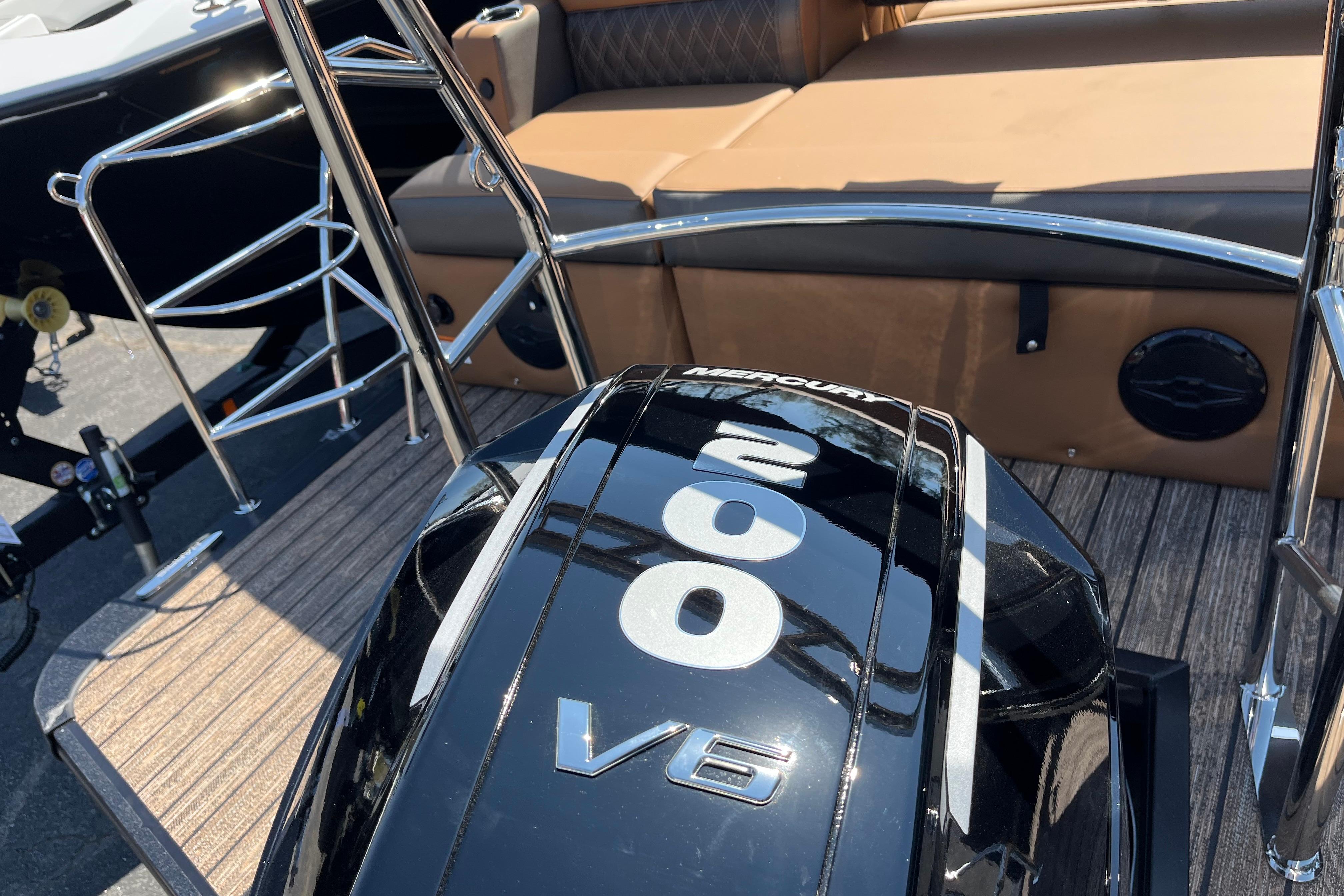 2026 Harris Cruiser 230 SL with Mercury 200 V6 engine, featuring sleek design and seating.