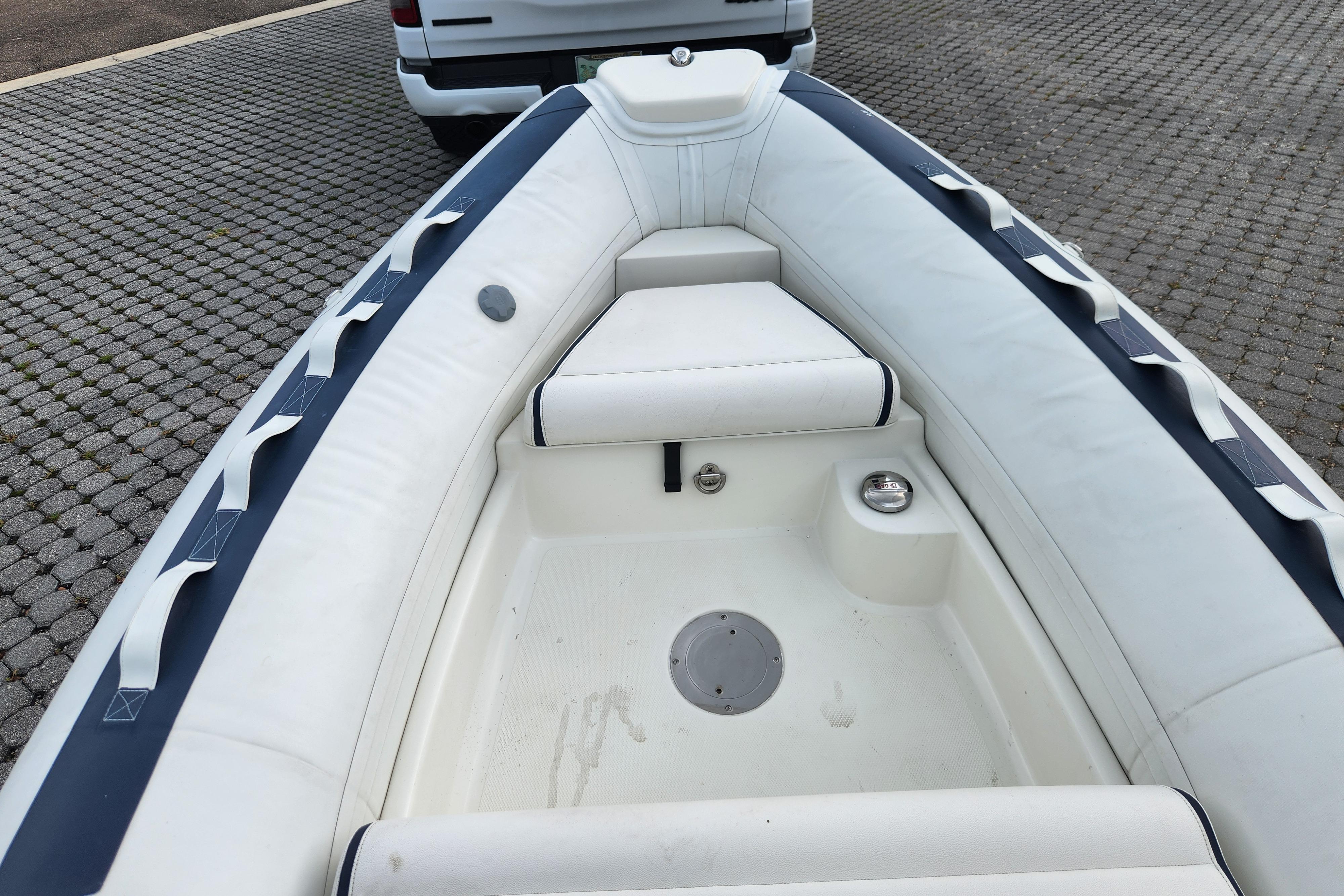 2019 Novurania DL 400 inflatable boat interior with white seating and blue accents.