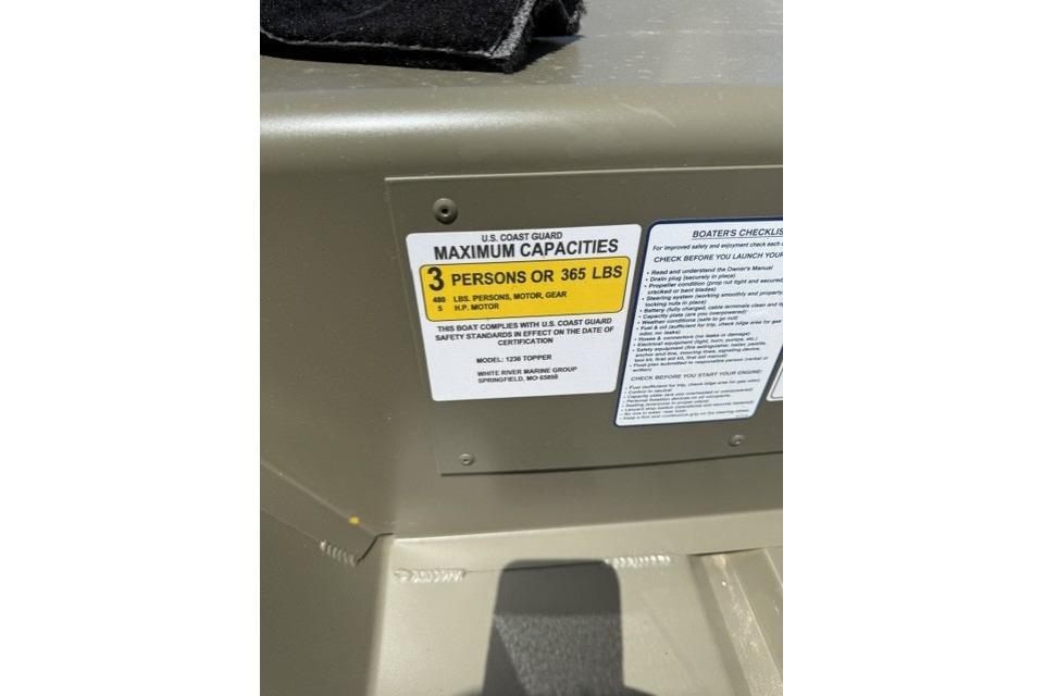 2026 Tracker Grizzly 12 Jon boat capacity label, showing maximum of 3 persons or 365 lbs.