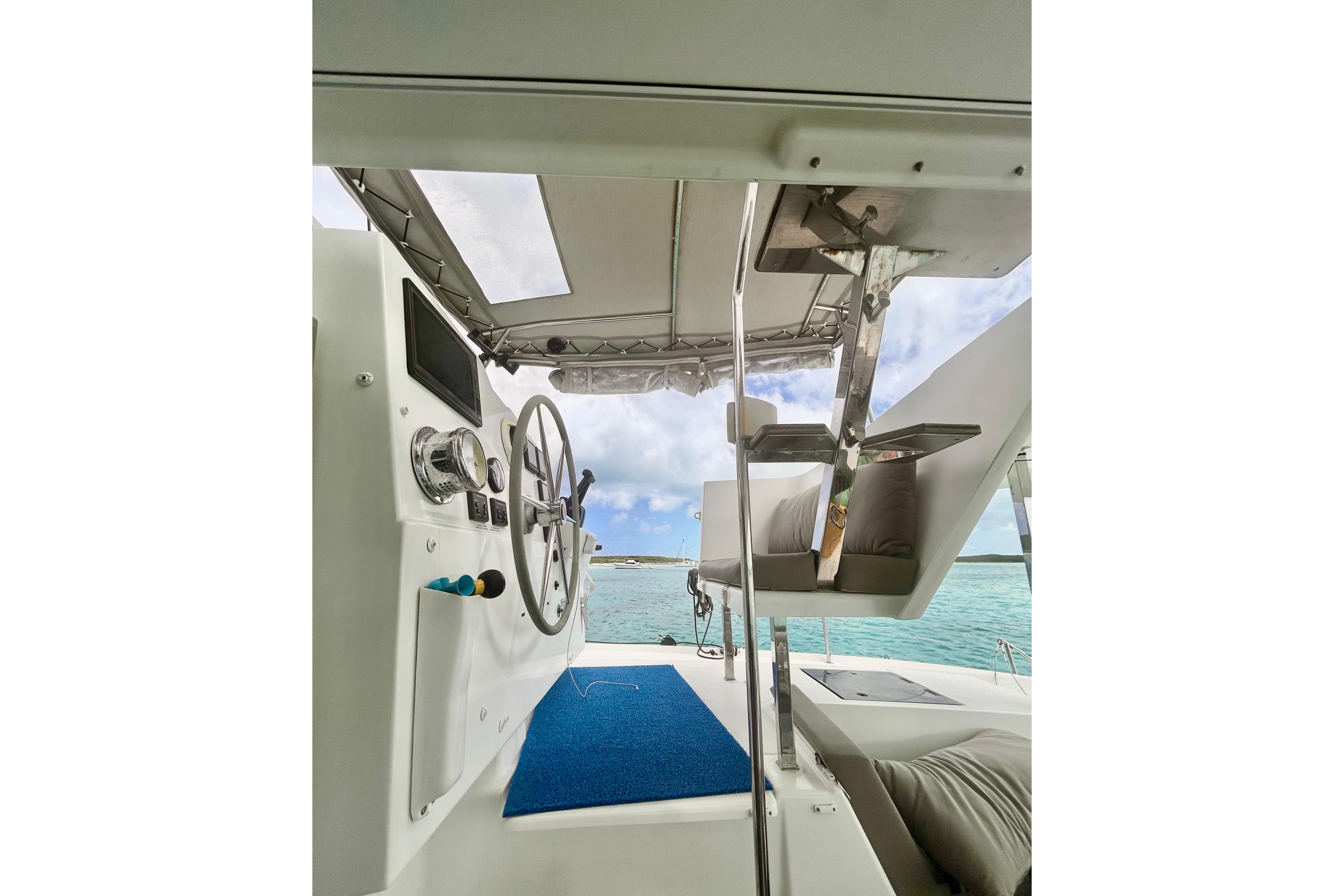 Helm of 2018 Fountaine Pajot Lucia 40 catamaran with ocean view.
