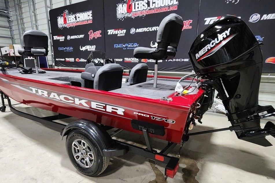 2026 Tracker Pro 170 boat with Mercury engine in showroom display.