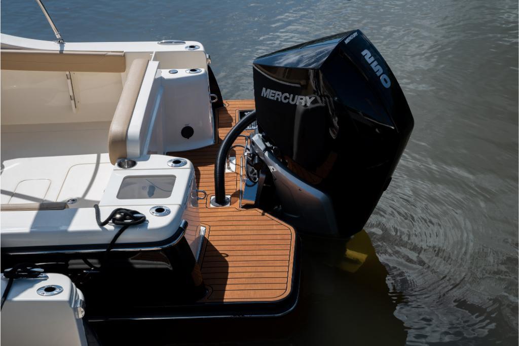 2023 Scout 240 Dorado boat with Mercury outboard engine on water.