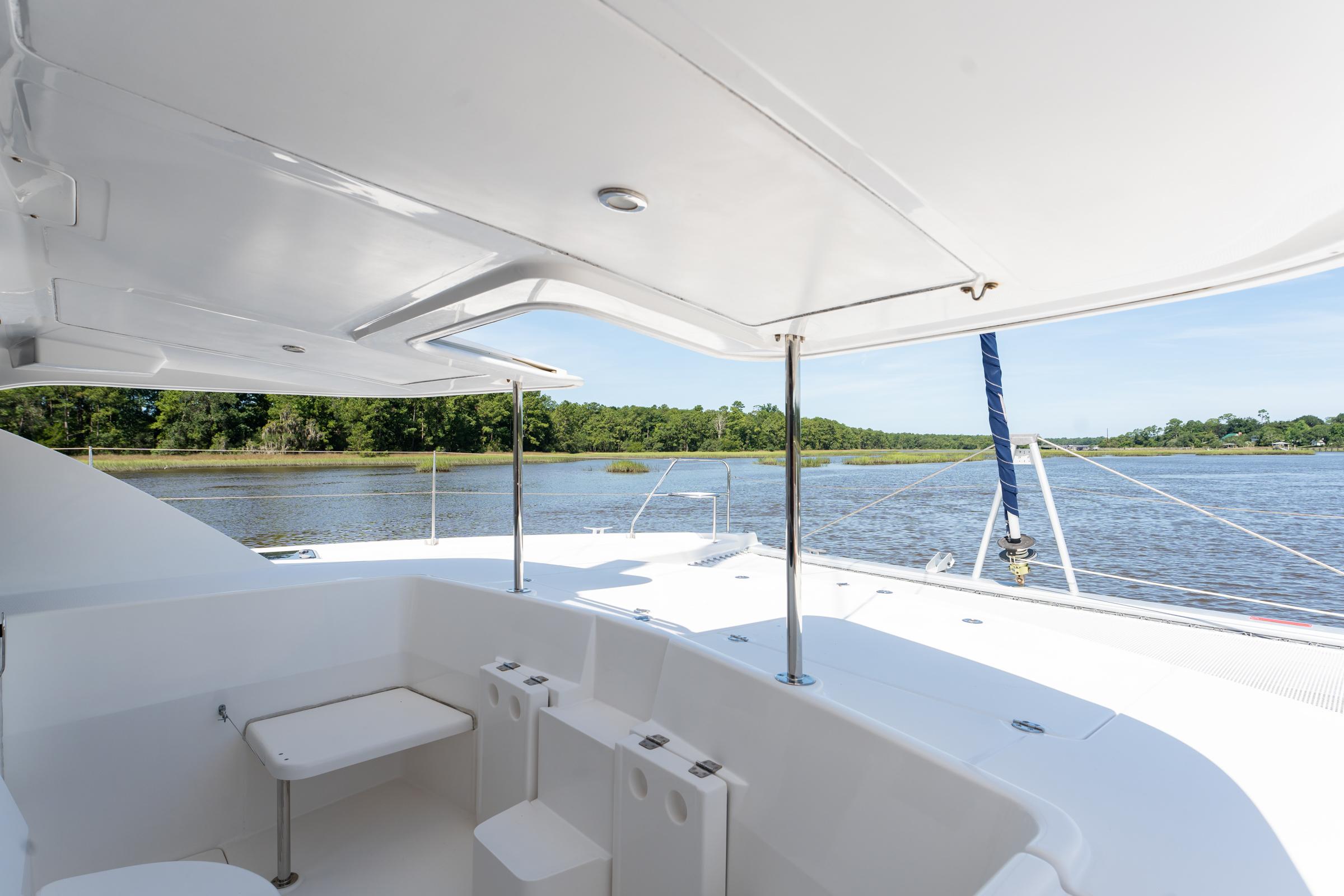 2016 Leopard 44 Owners Version catamaran, featuring spacious deck and scenic water view.