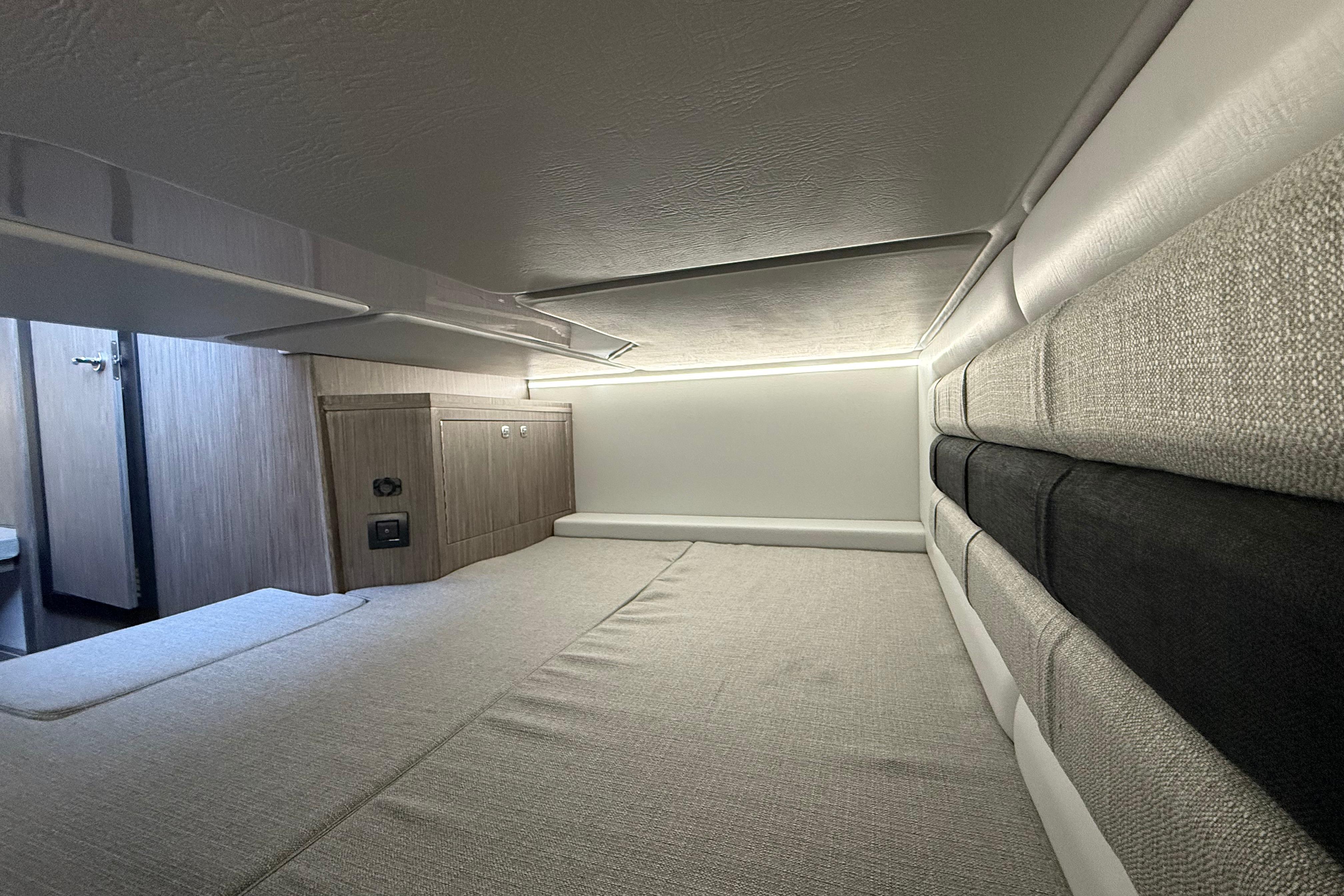 Interior cabin of 2026 Ranieri CAYMAN 38.0 EXECUTIVE, featuring modern design and comfortable bedding.