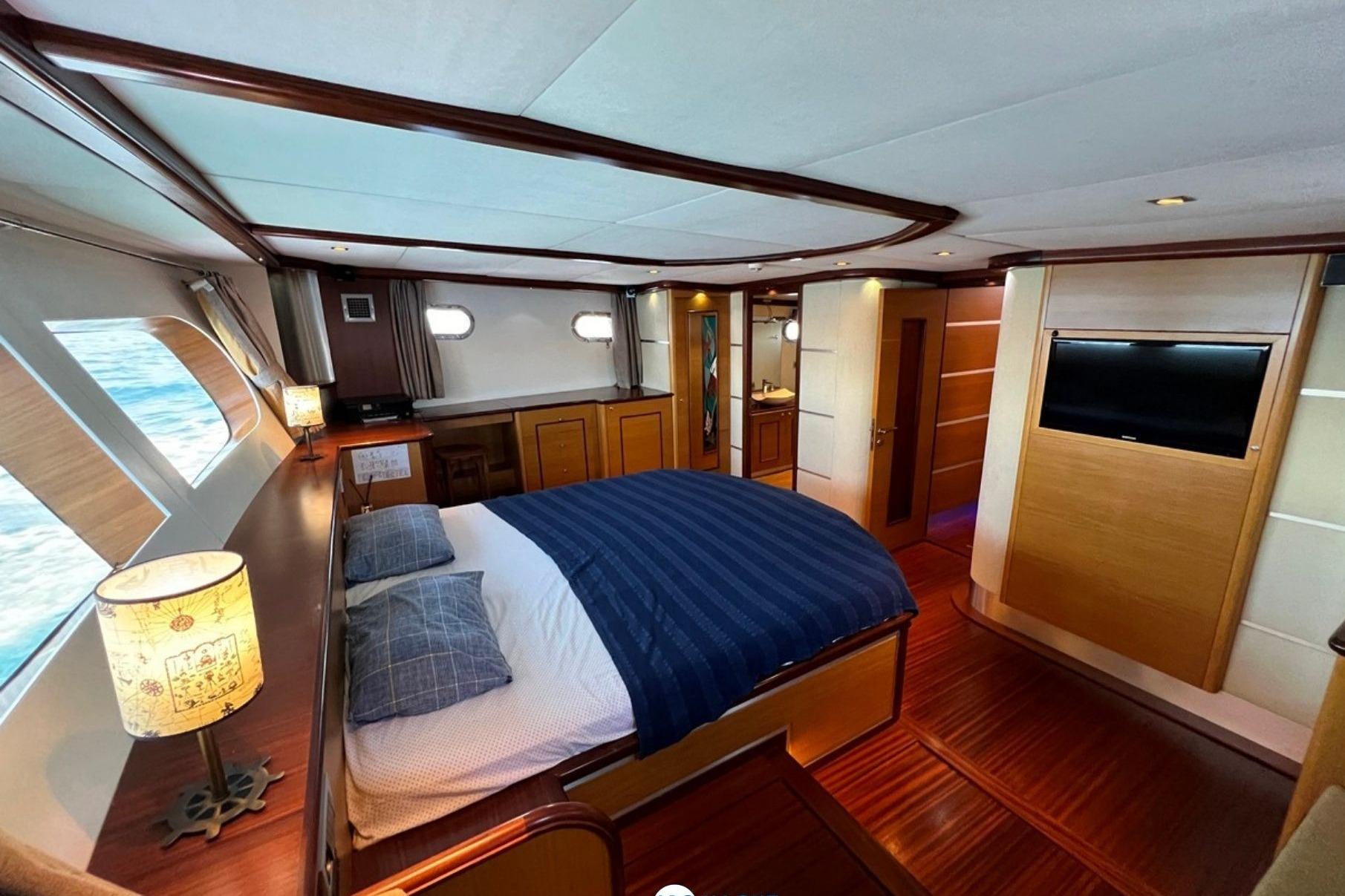 Luxurious bedroom interior of 2014 Ark Yat 24M yacht with ocean view.