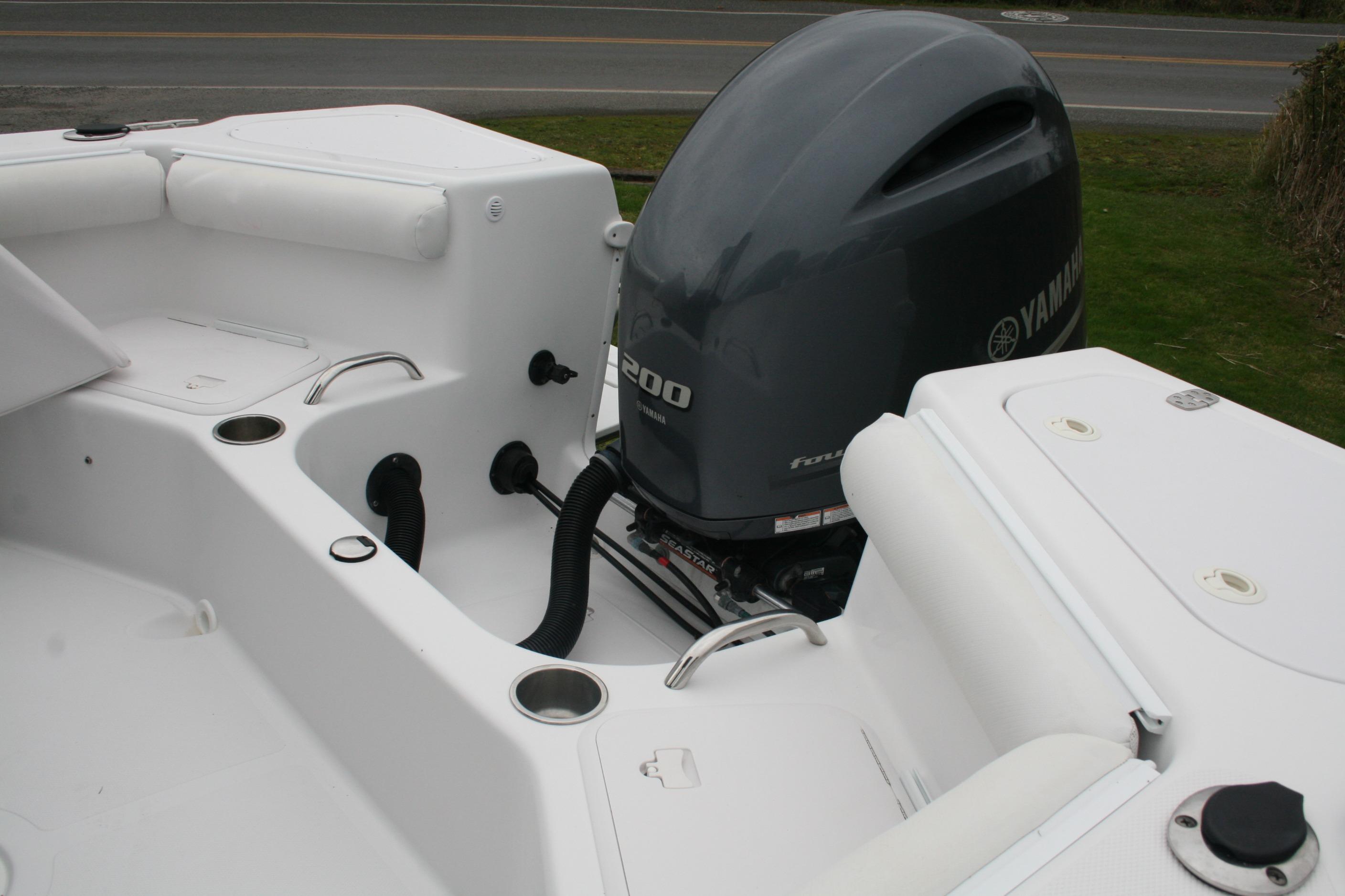 2013 Pro-Line 20 Express boat with Yamaha 200 outboard motor, white interior.