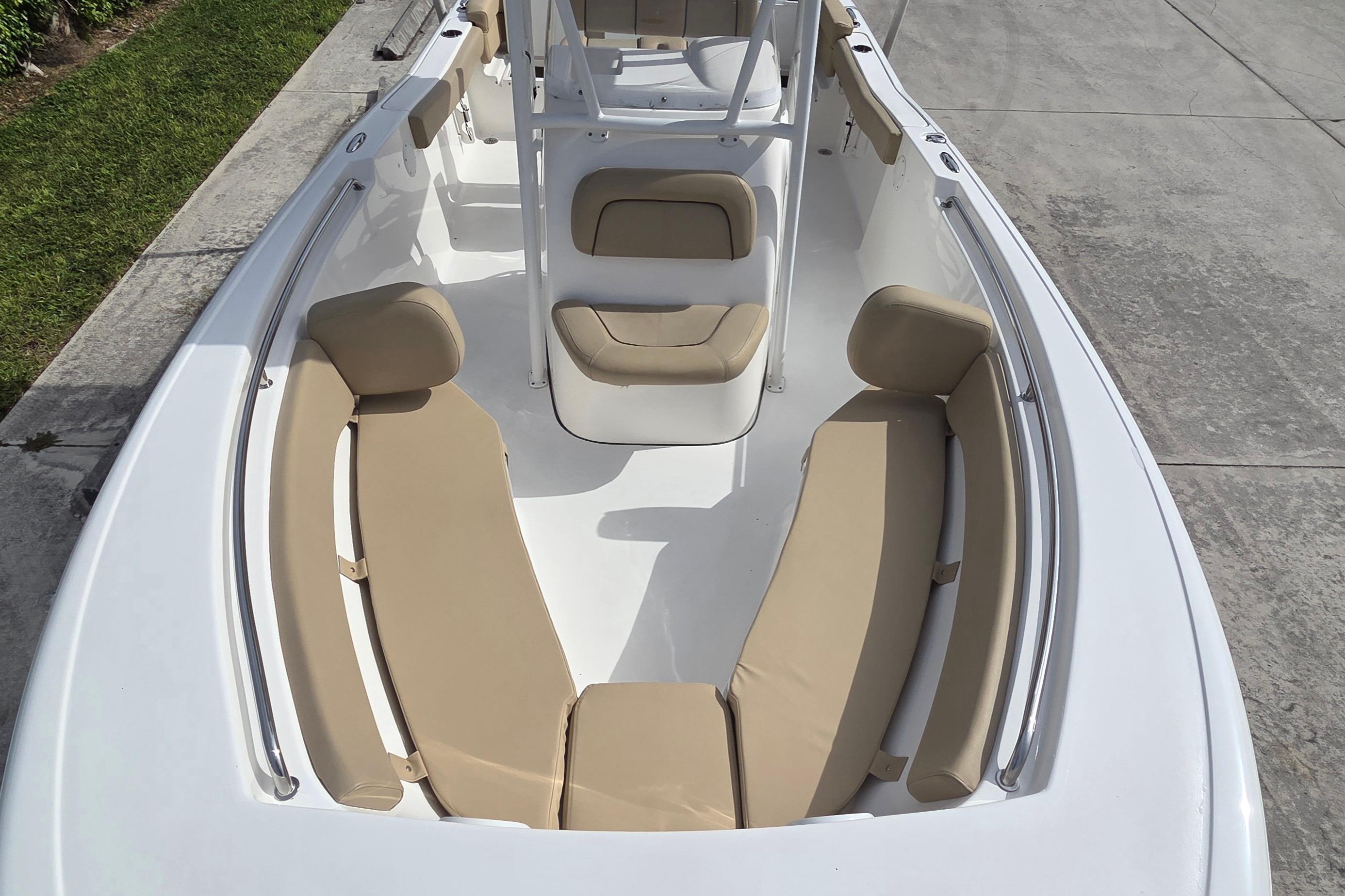 2015 Tidewater 220 LXF boat interior with beige seating and white deck.