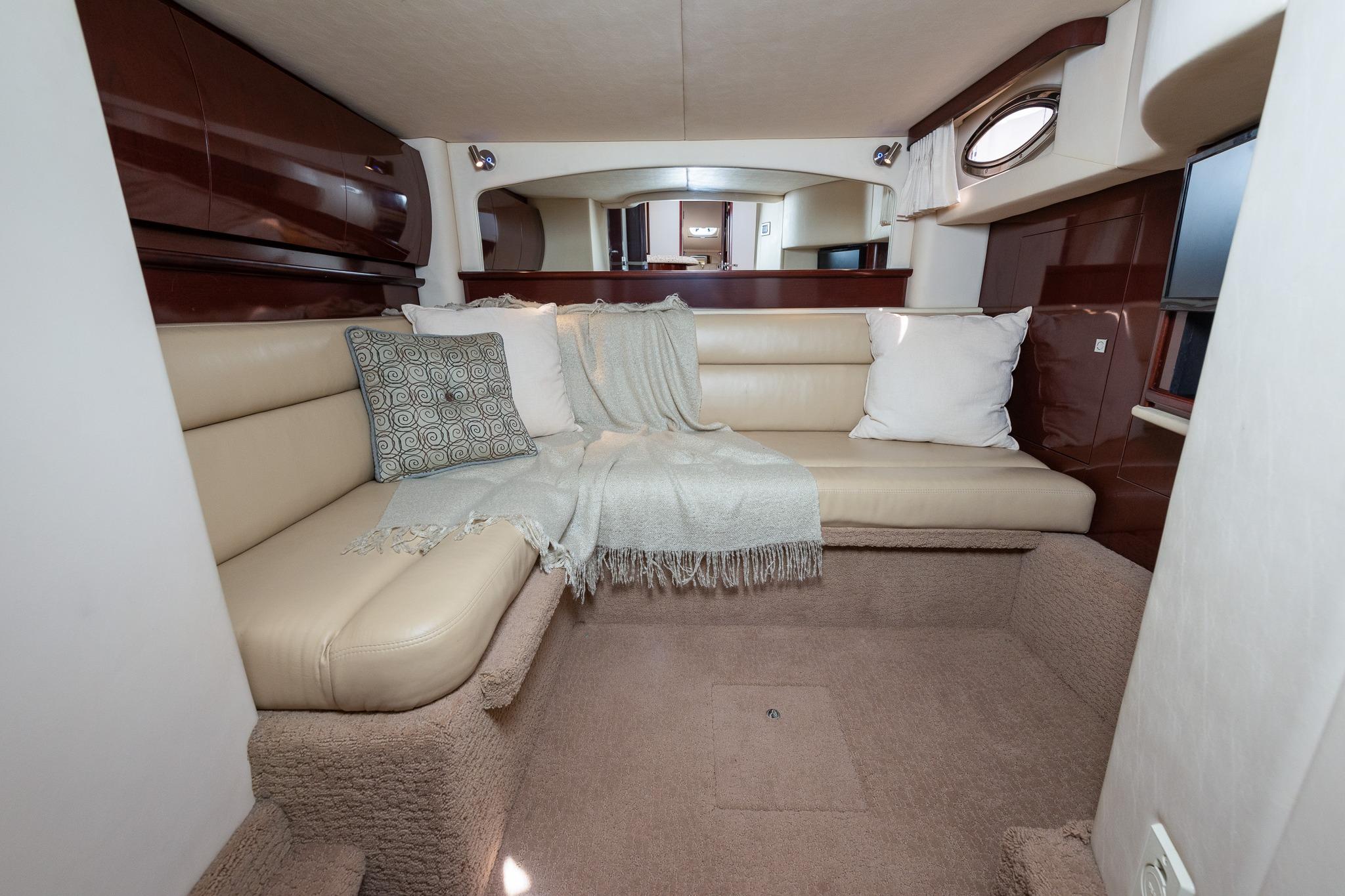 Luxurious interior of 2008 Sea Ray 44 Sundancer yacht with beige seating and cushions.