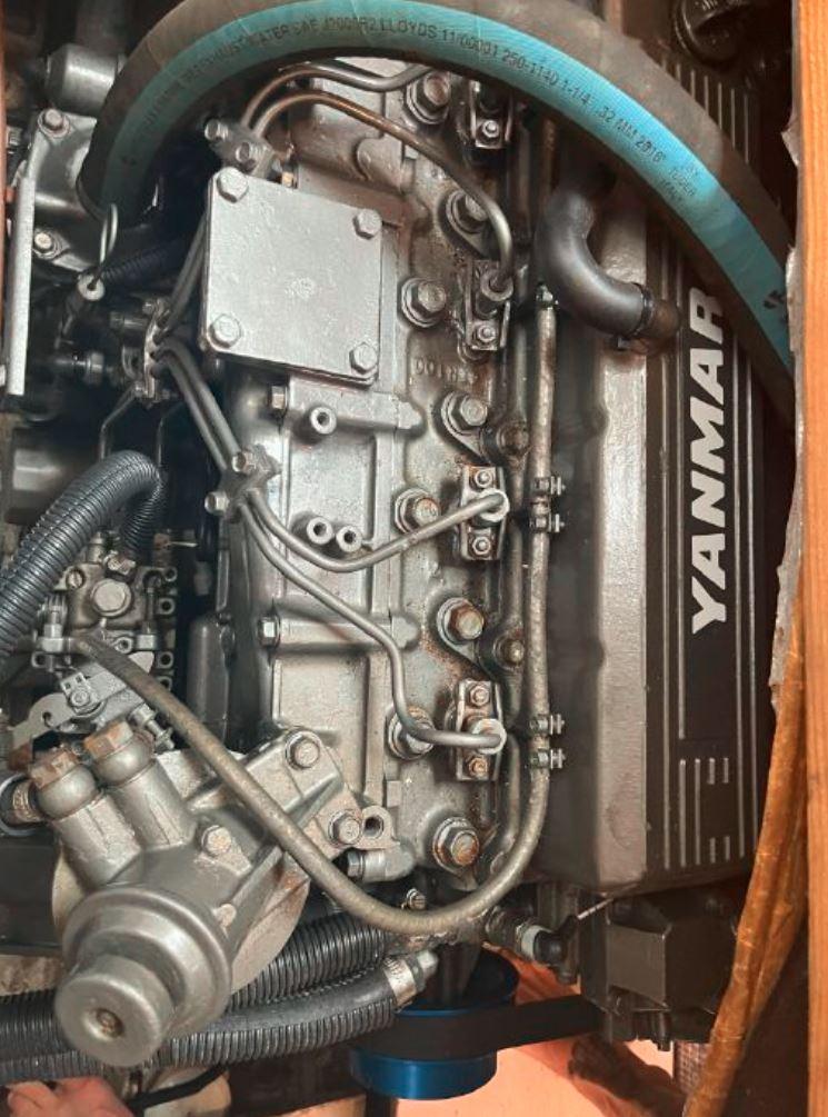 Yanmar engine in a 1990 Irwin 54 sailboat, showcasing detailed mechanical components.