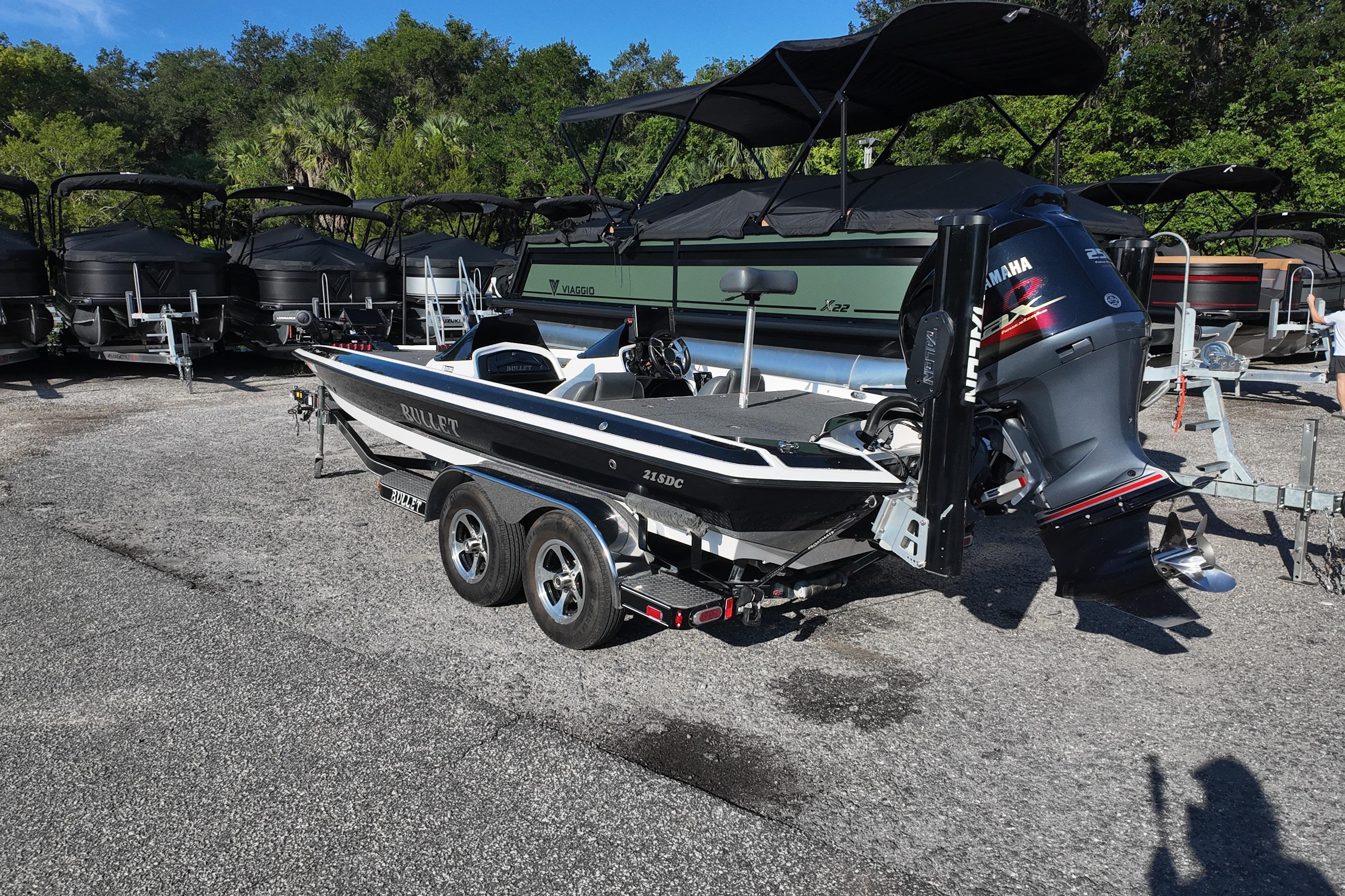 2022 Bullet 21SDC boat with Yamaha engine on trailer, parked outdoors.
