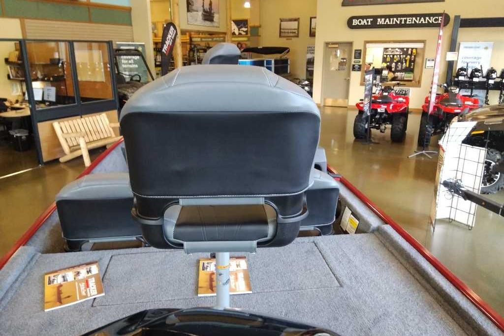 2026 Tracker Bass Tracker Classic XL boat interior in showroom with maintenance area.