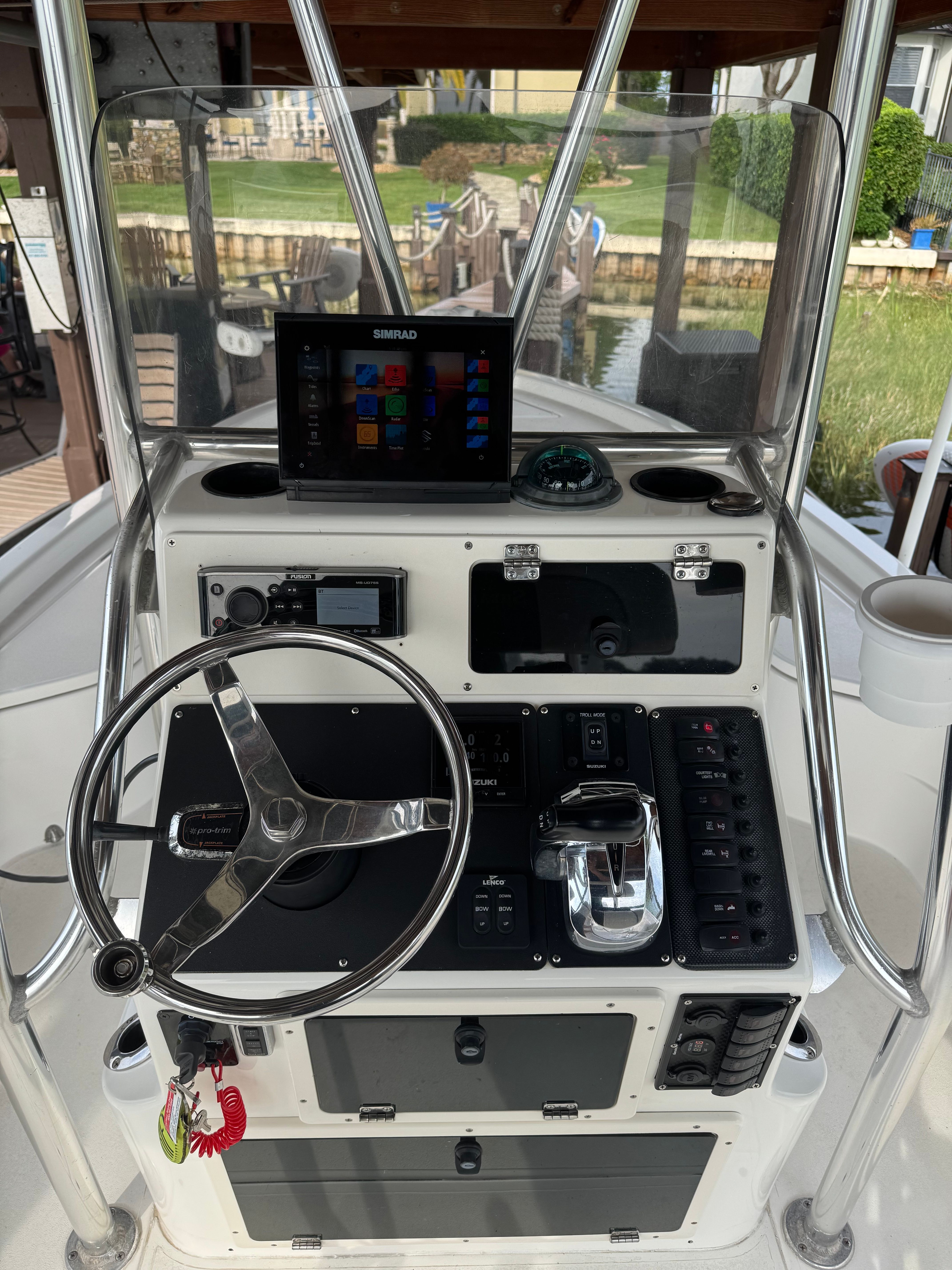 2004 ShearWater LTZ boat helm with Simrad display and controls.