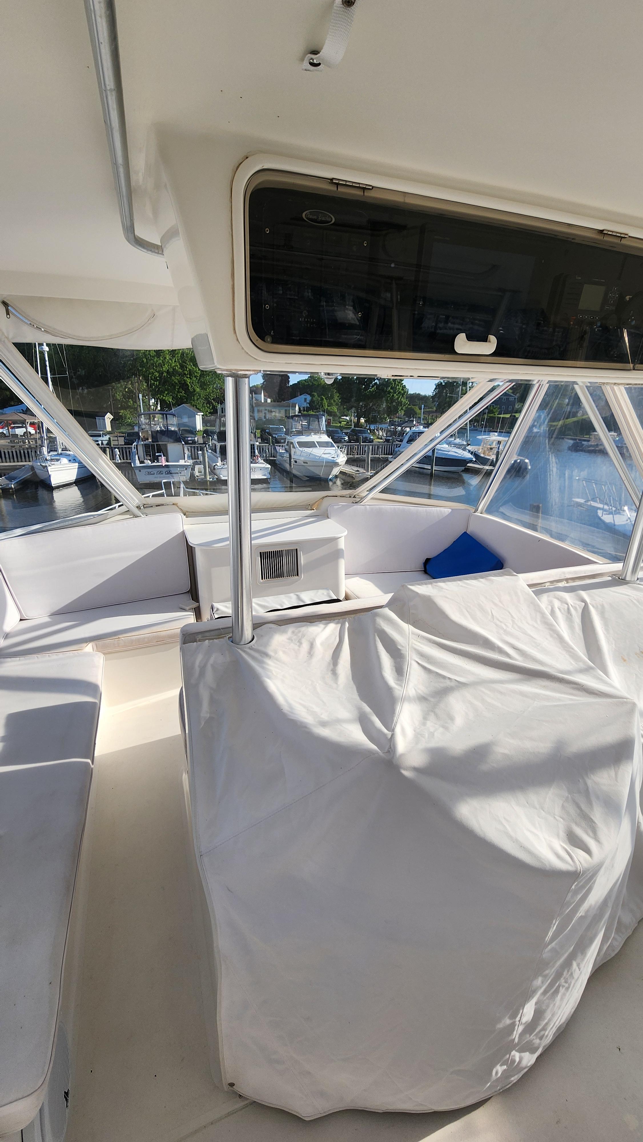 Interior view of a 2001 Ocean Yachts 56 Super Sport boat, featuring covered seating.