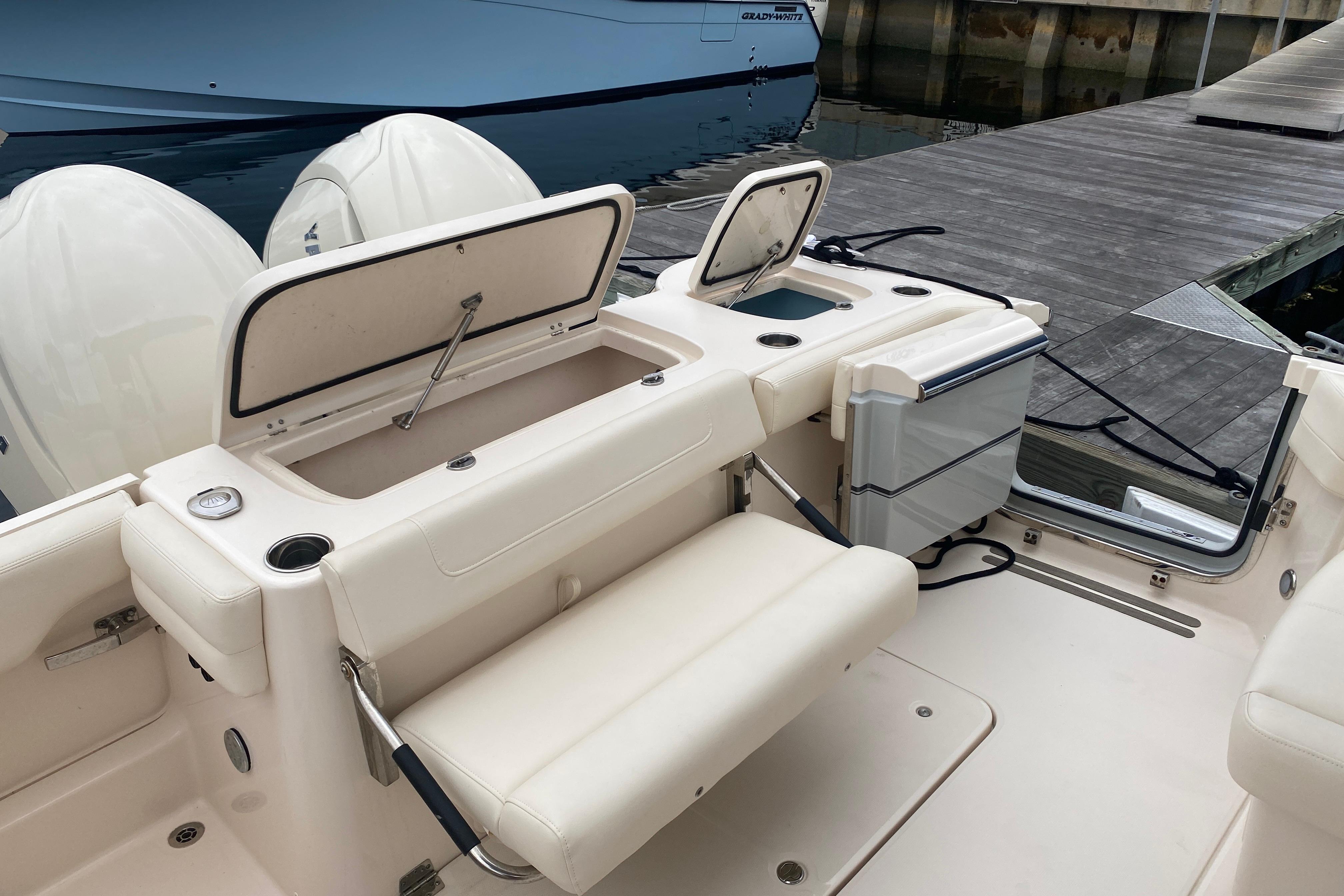 2025 Grady-White Freedom 307 boat interior with seating and storage compartments at dock.