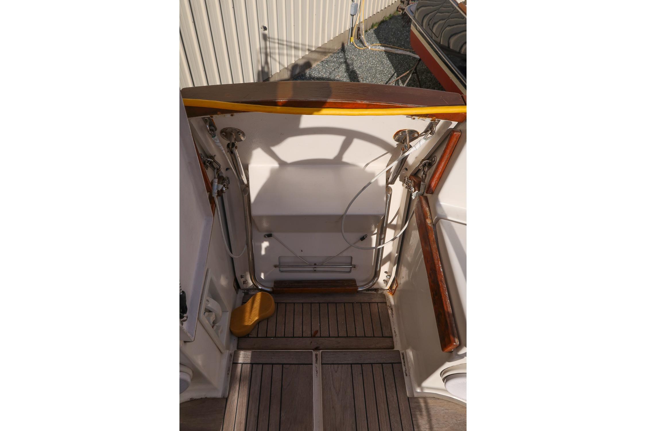 1999 Gozzard 37A yacht cockpit with wooden accents and nautical equipment.